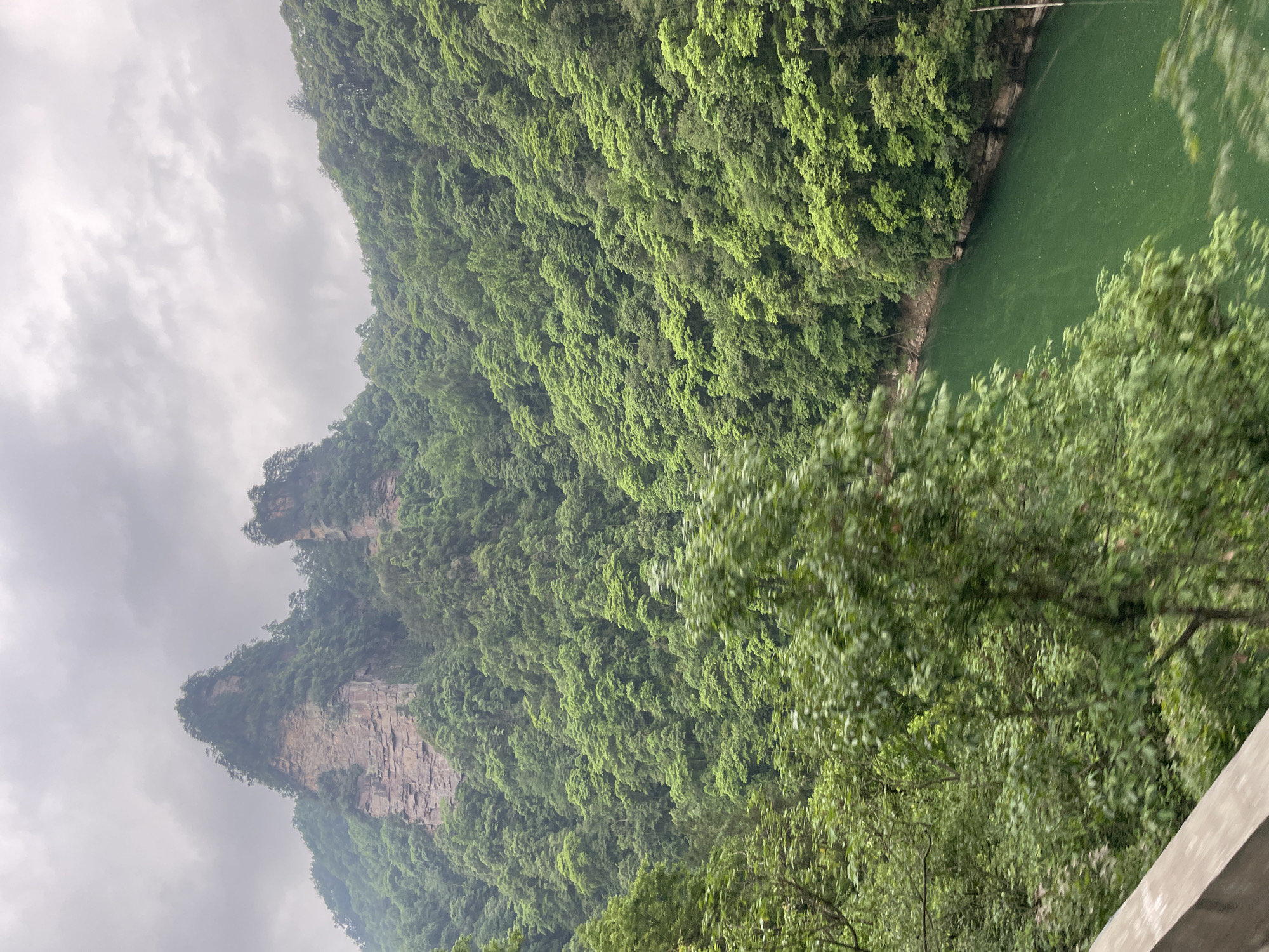 Tourist captures scenic Wulingyuan landscape views including Baofeng Lake
