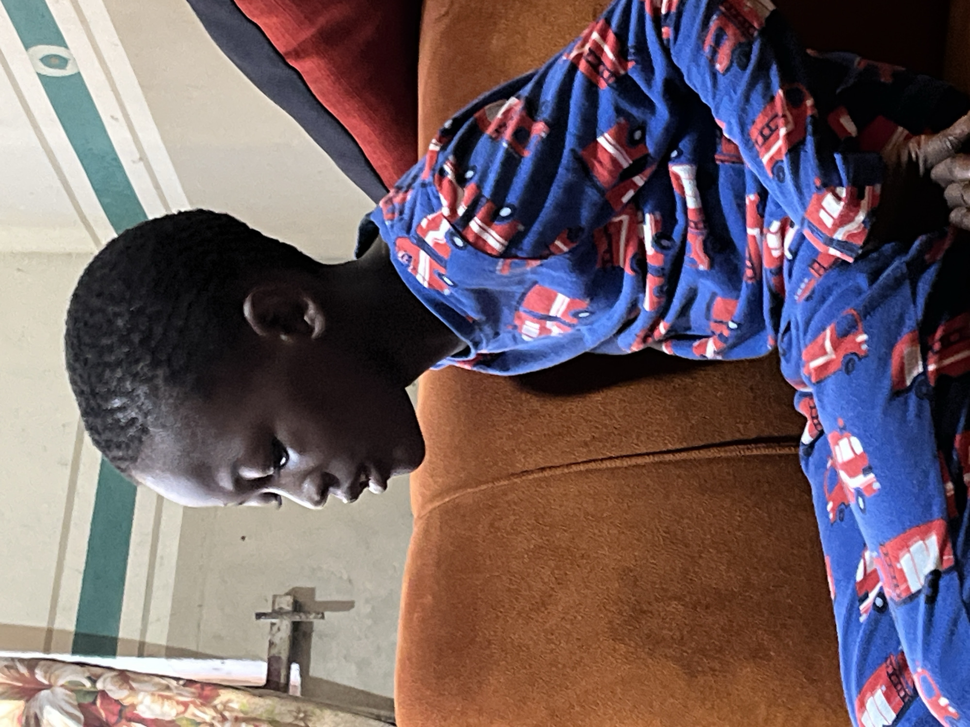 Children in car pajamas share meal, play in Badagry home