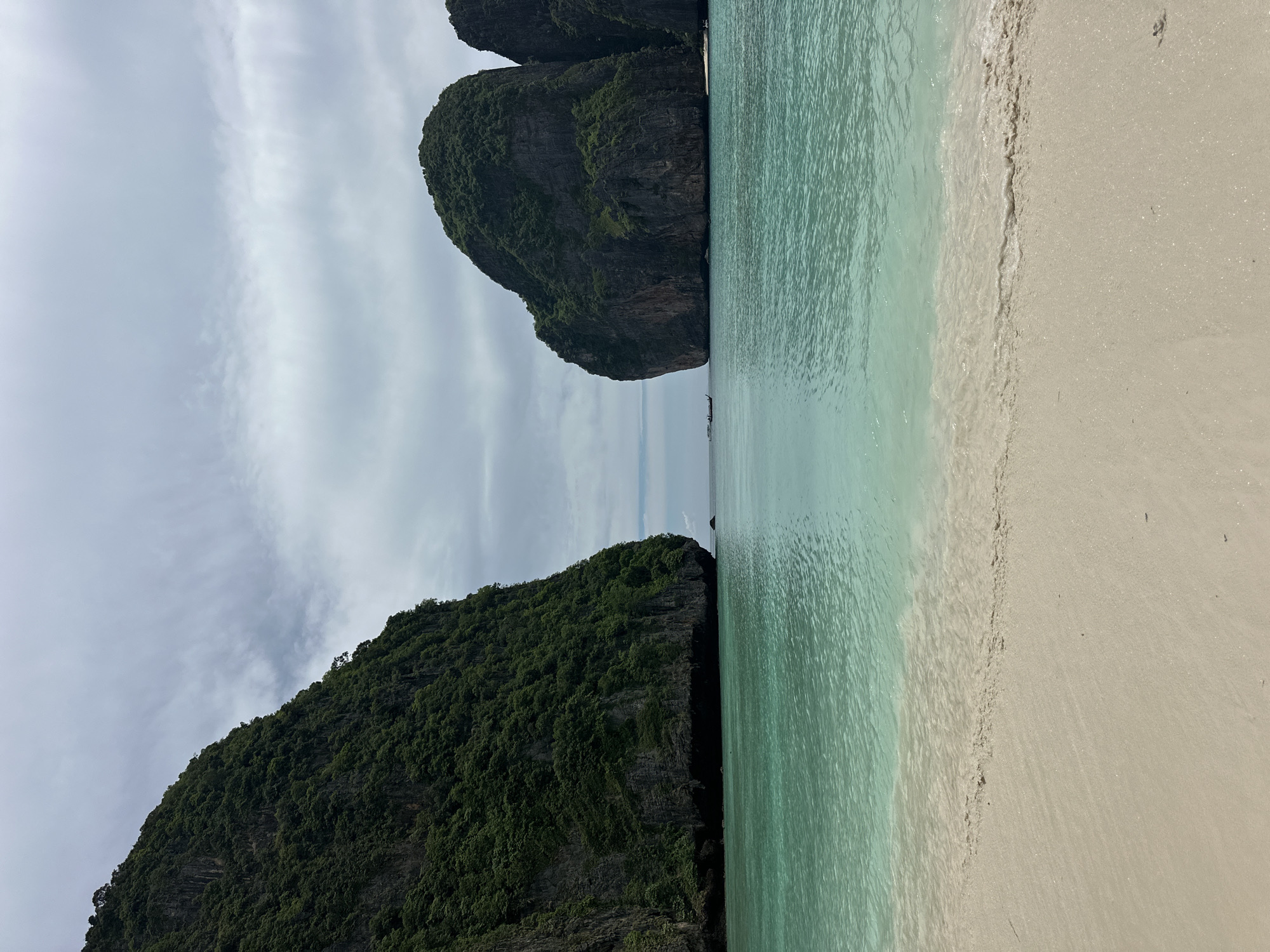 Dawn tourists explore Maya Bay's beaches amid limestone cliffs