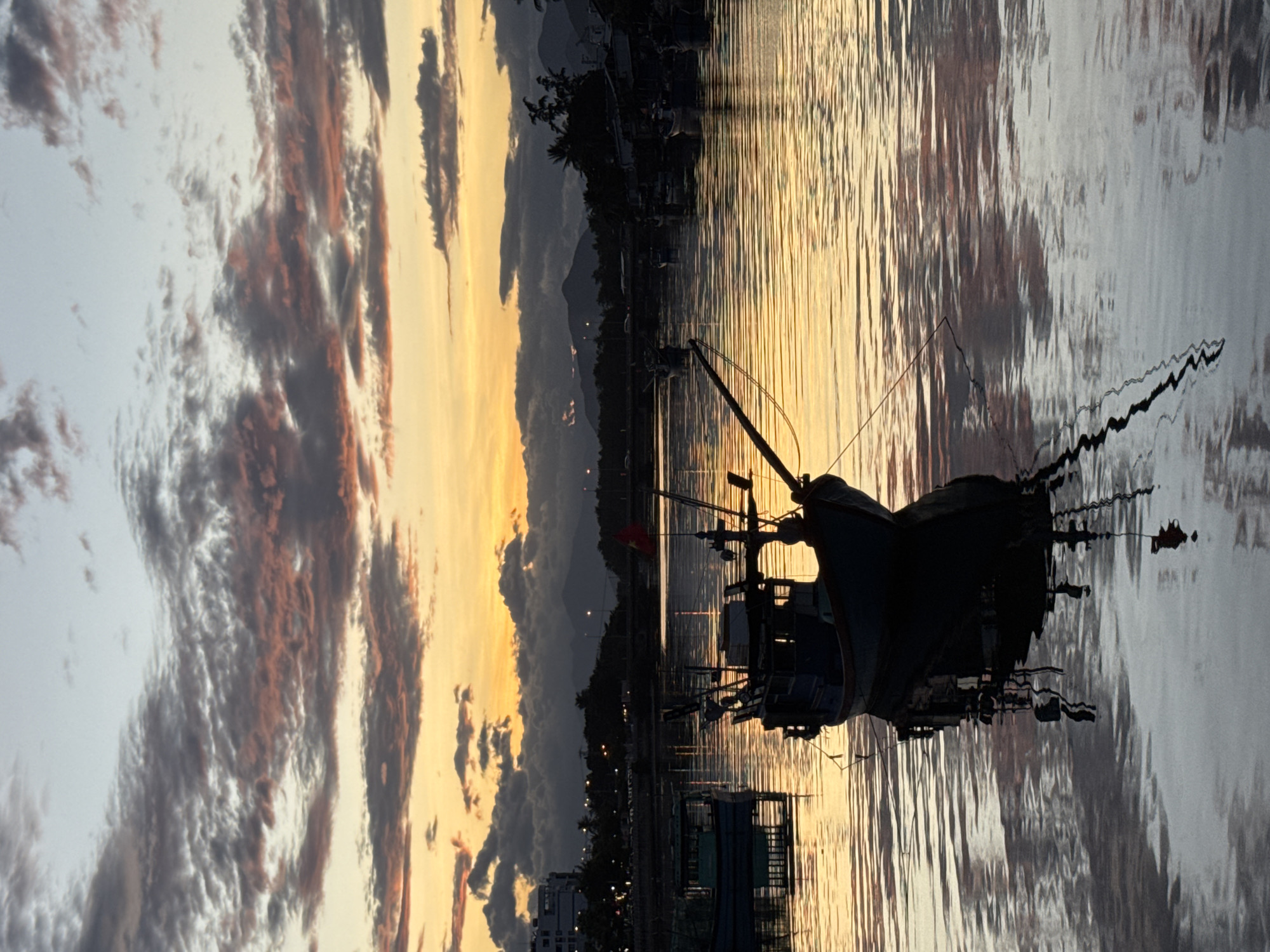 Nha Trang bay at golden hour, boats, railing views, and open water