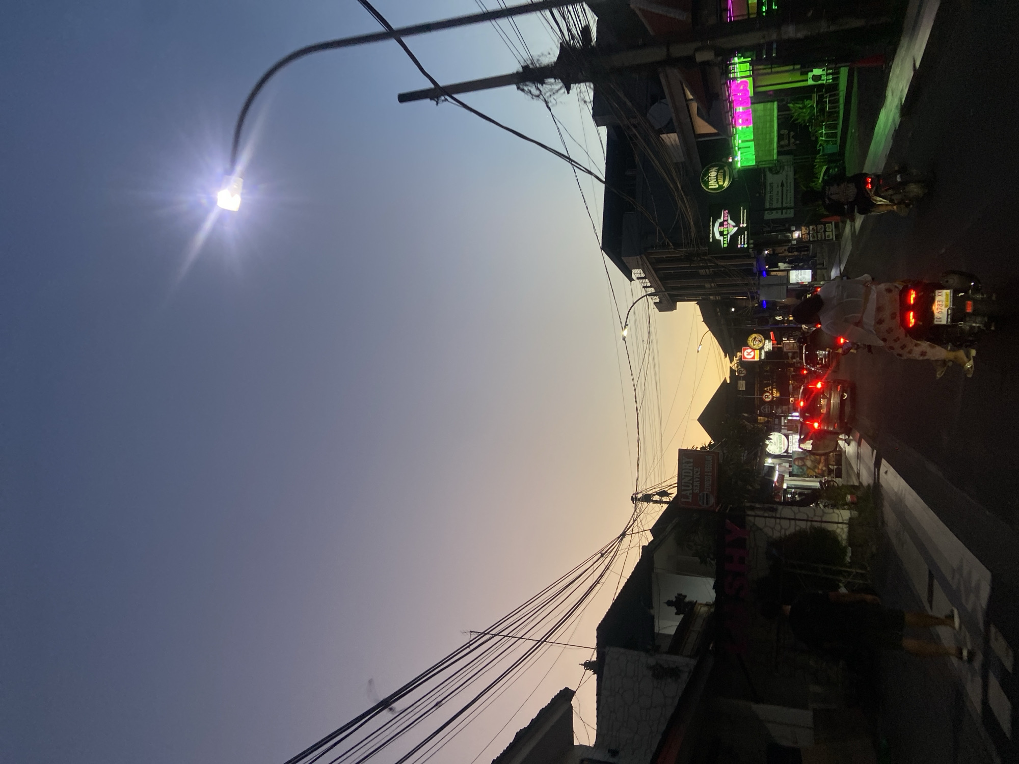 Evening street life documented in Kuta commercial district