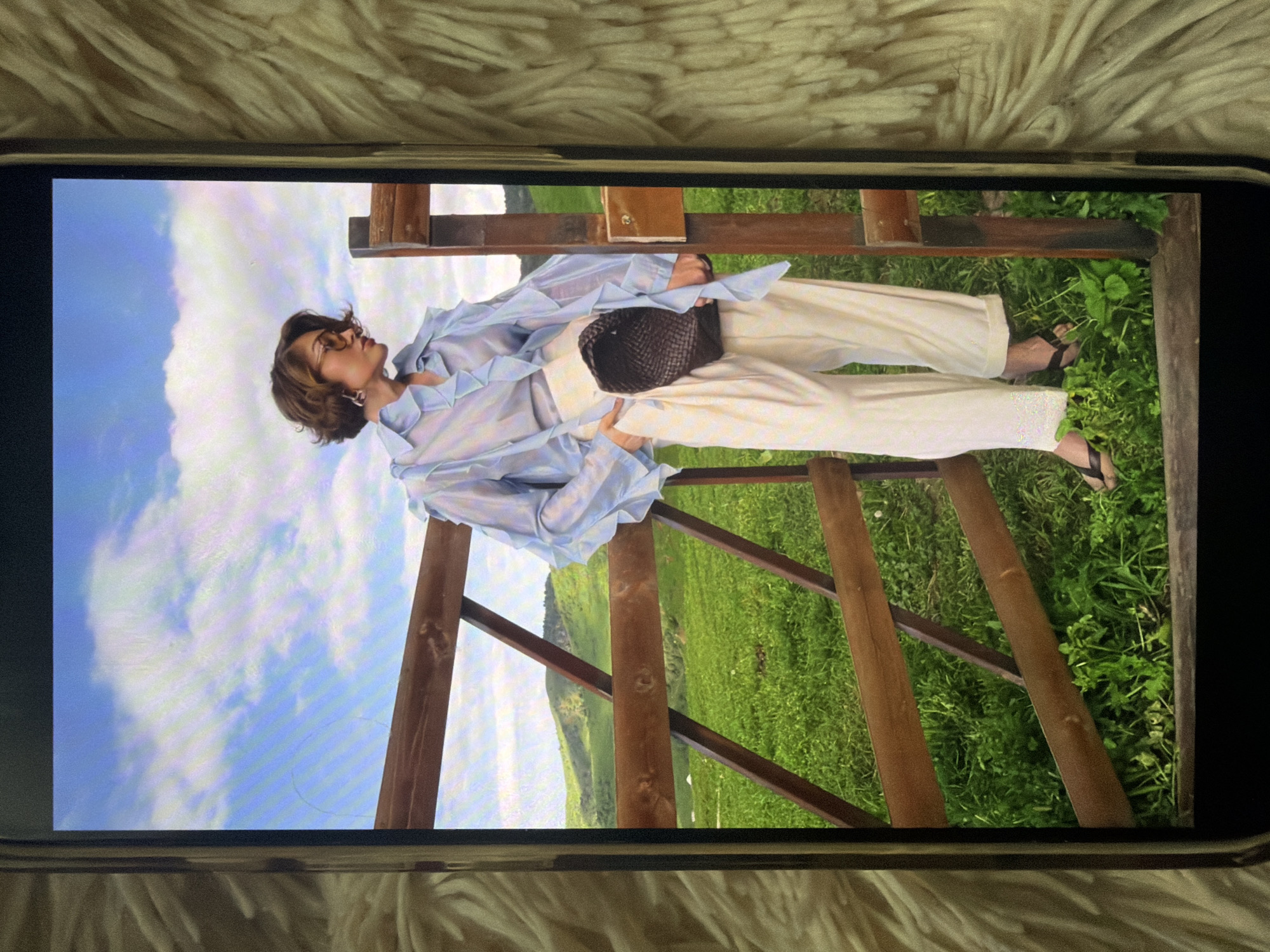 Summer photoshoot memories viewed on smartphones in Bishkek