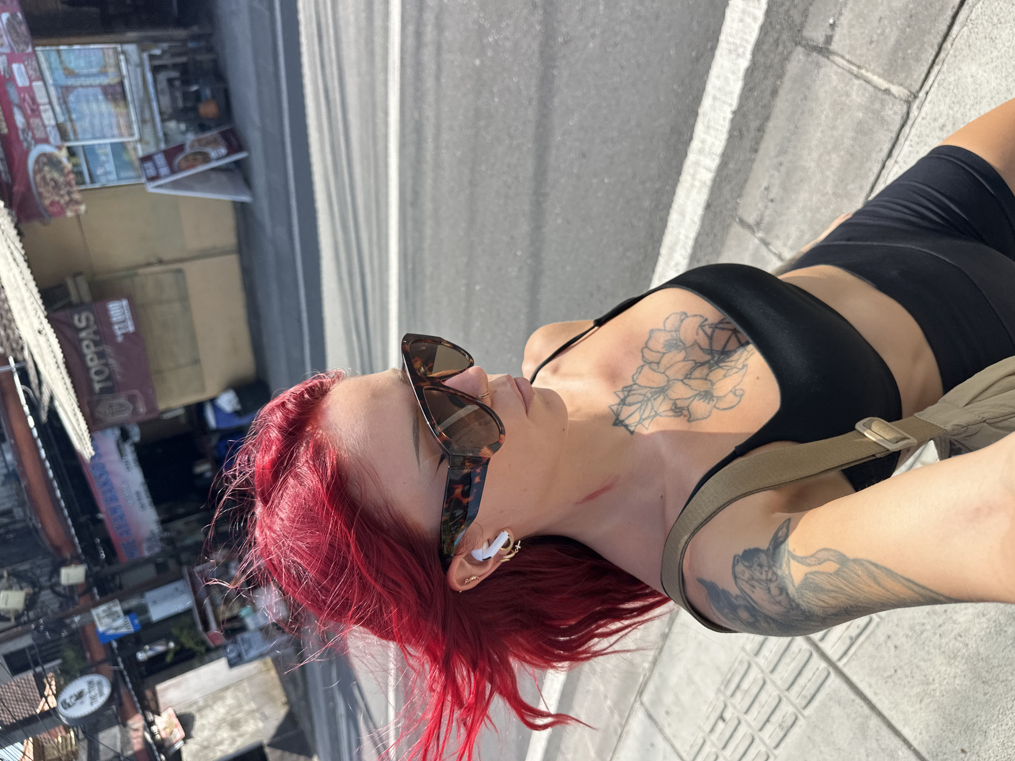 Red-haired woman photographed multiple times on North Kuta streets