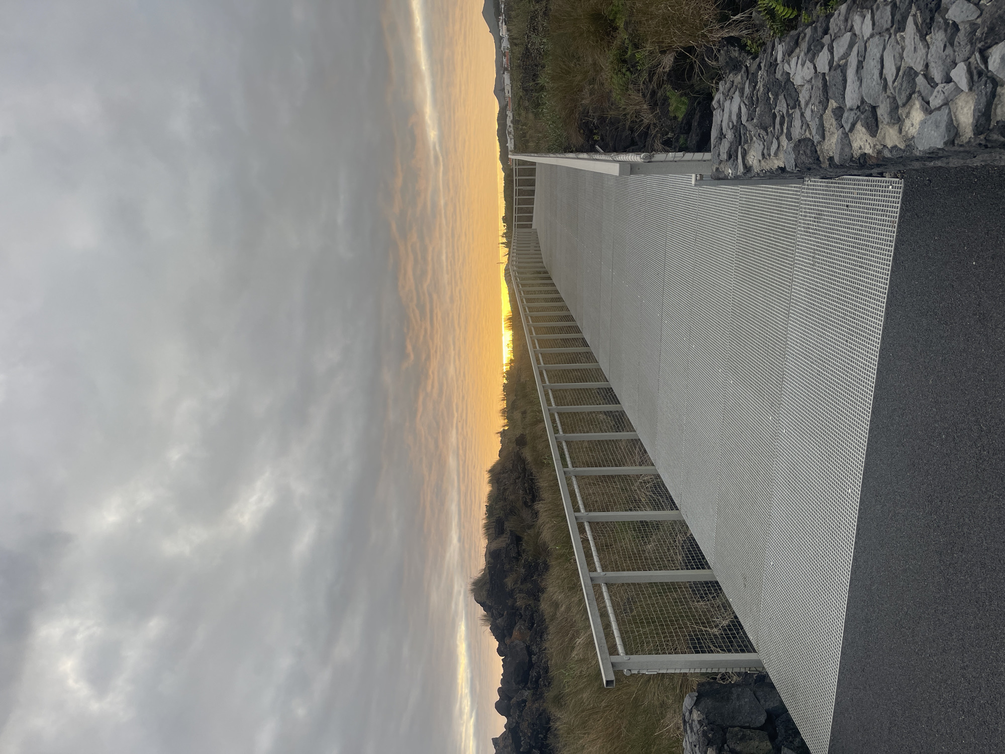 Metal walkway photographed at sunset in Portuguese coastal town
