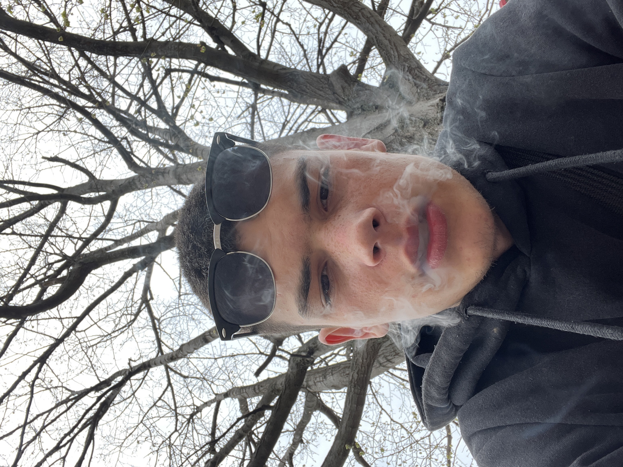 Young man films selfies, social media content in Sopot