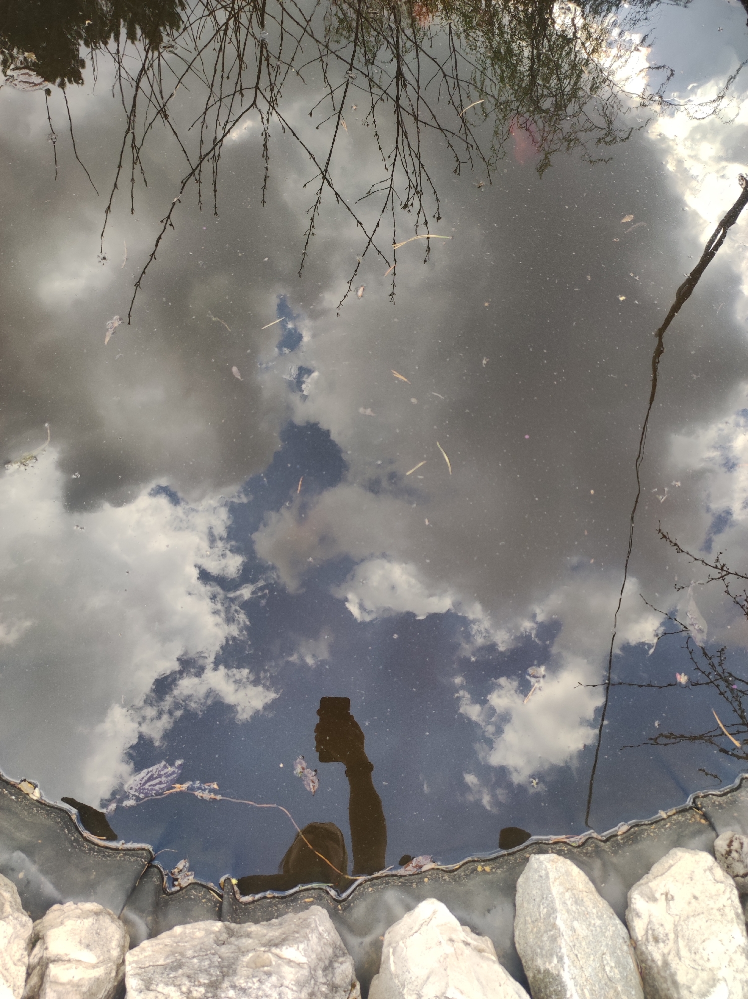 Toddler plays outdoors under cloudy skies in Russian village