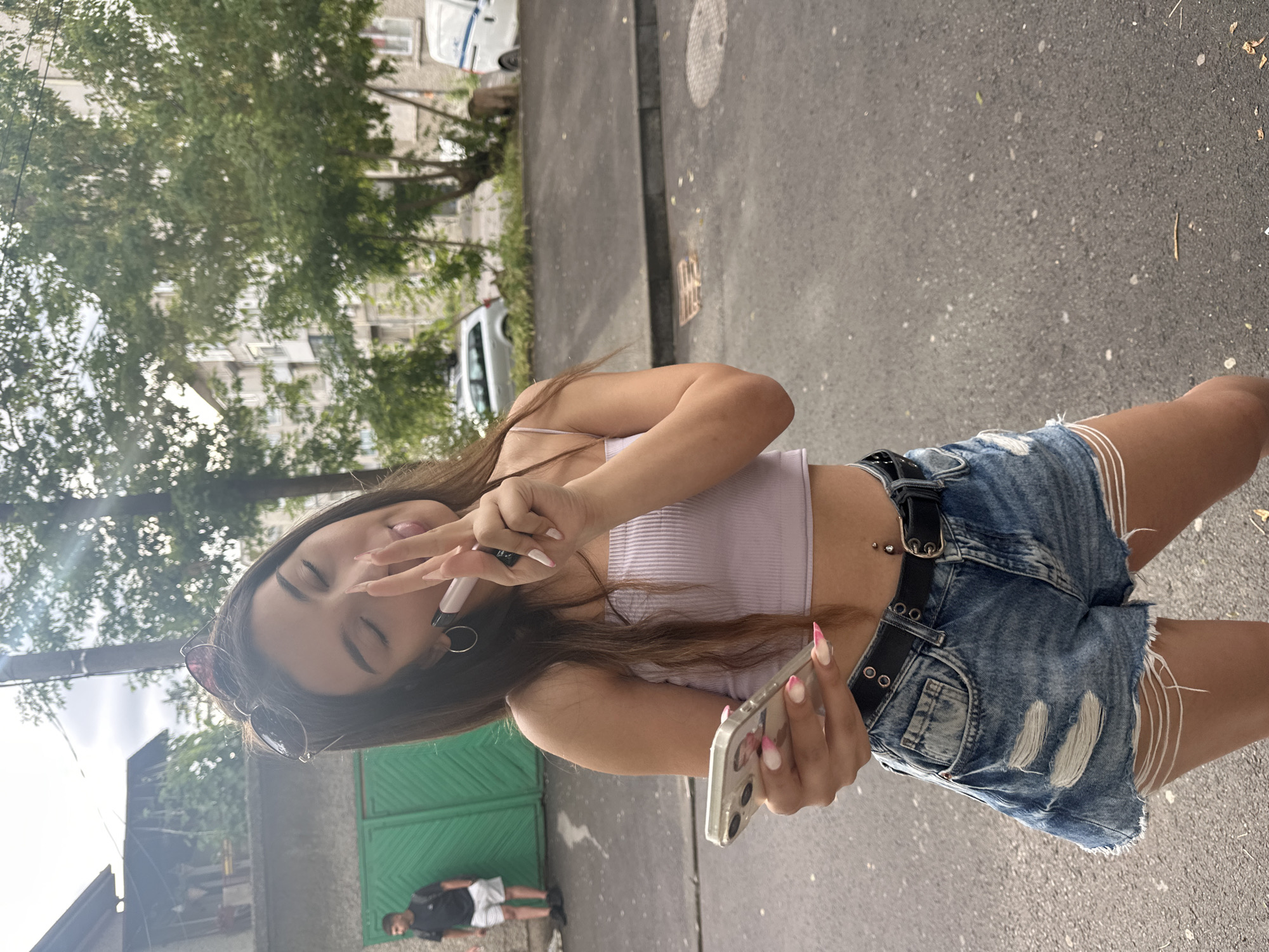 Friends taking selfies on a Shumen street, June morning