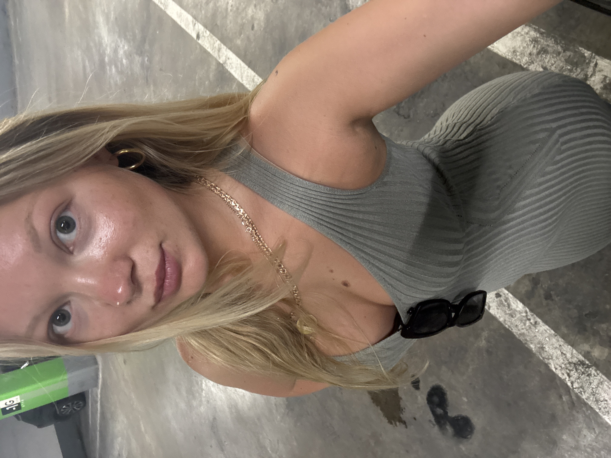 Woman spotted in Herzliya parking garage wearing gray dress