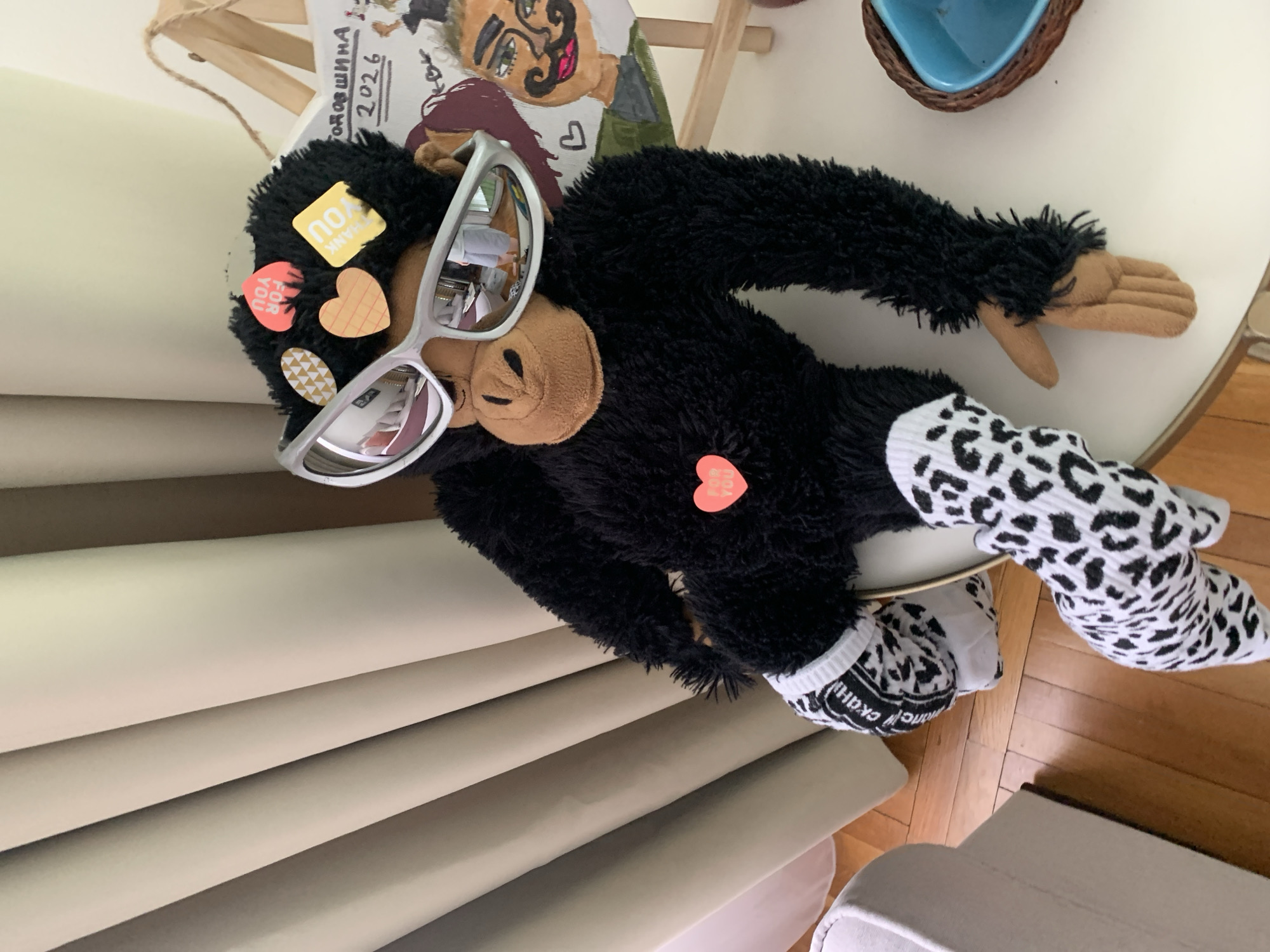 Sunglasses-wearing plush gorilla toy photographed indoors in Serbia