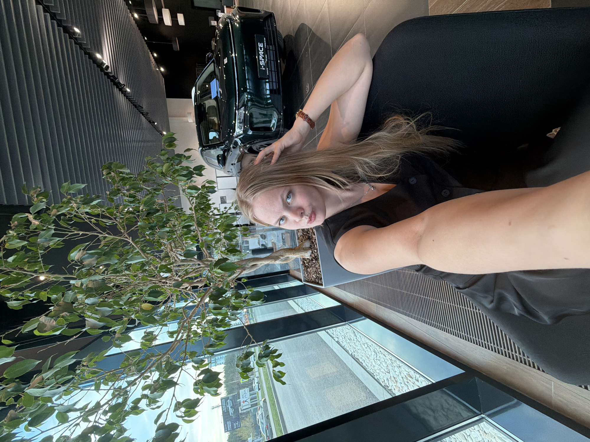 Woman takes selfies by window in Izhevsk apartment