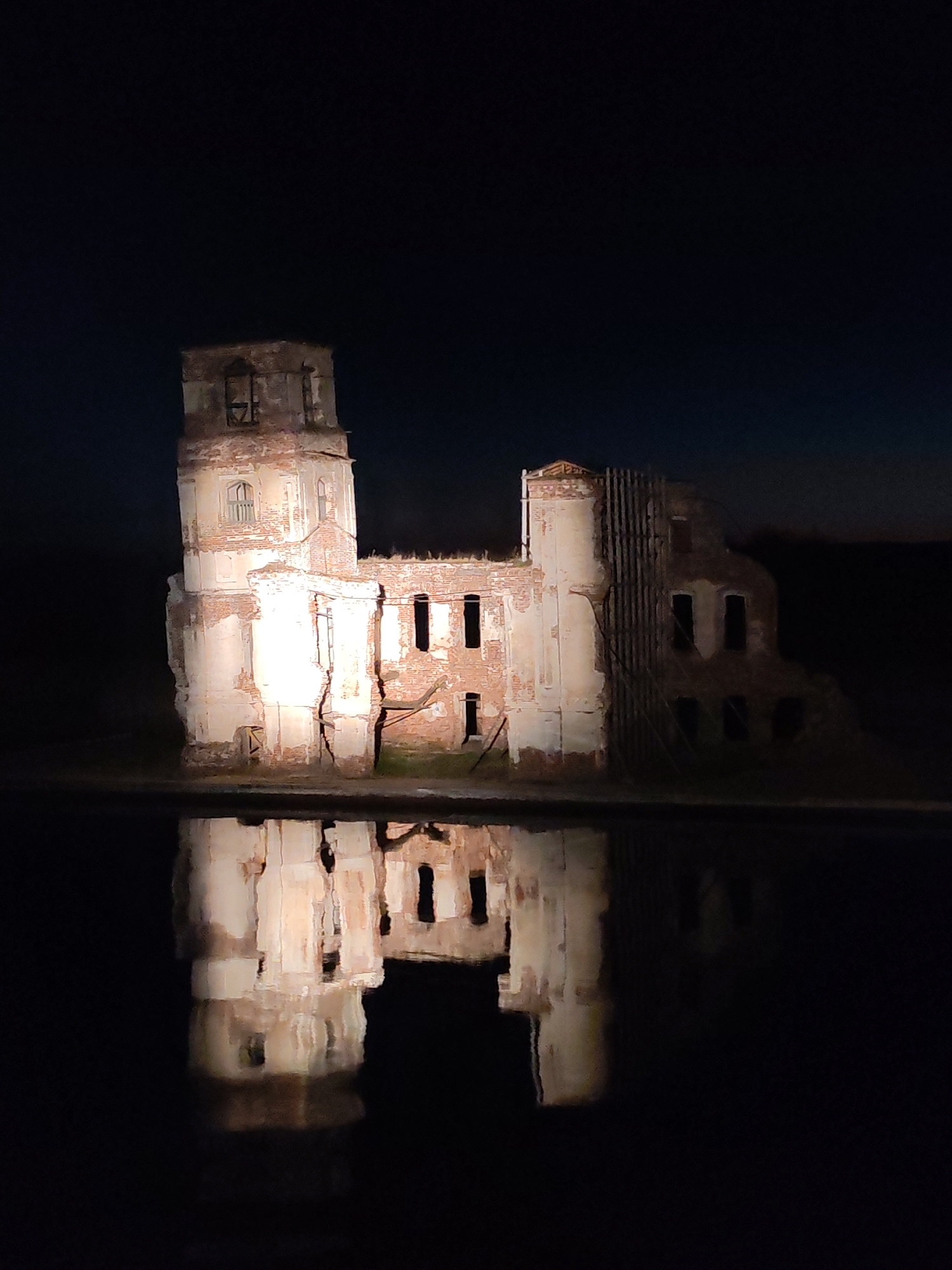Flooded church ruins captured at night in Krokhino, Russia