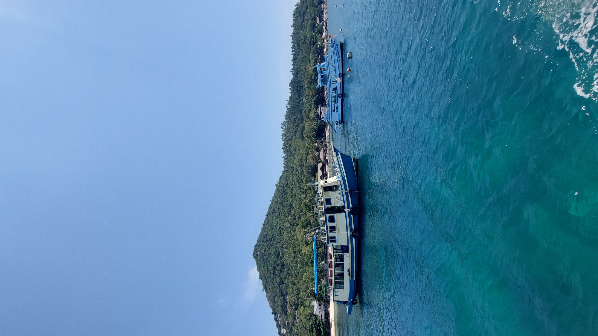 Morning boats anchor off Ko Tao's tropical coastline