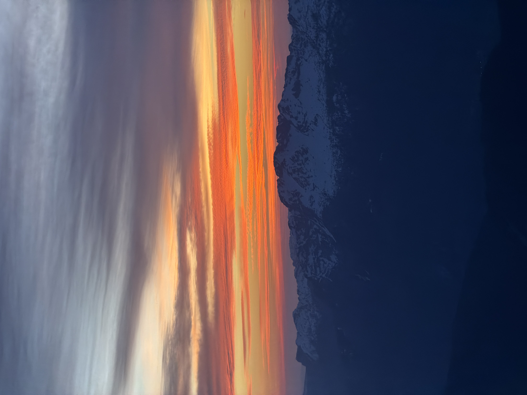 Vibrant sunset captured over snow-covered Alps in La Giettaz