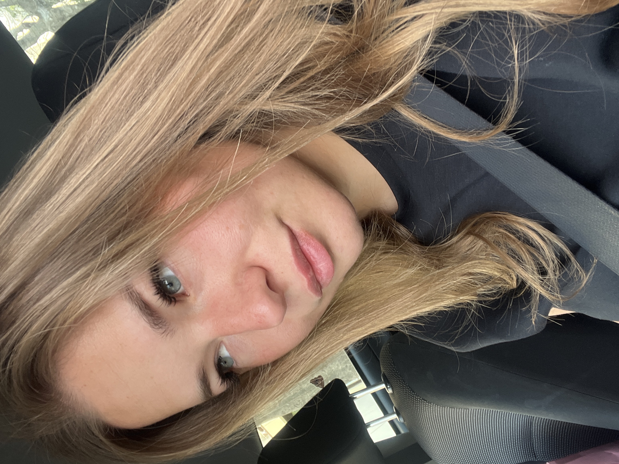 Woman seated in car observed in Budva, Montenegro
