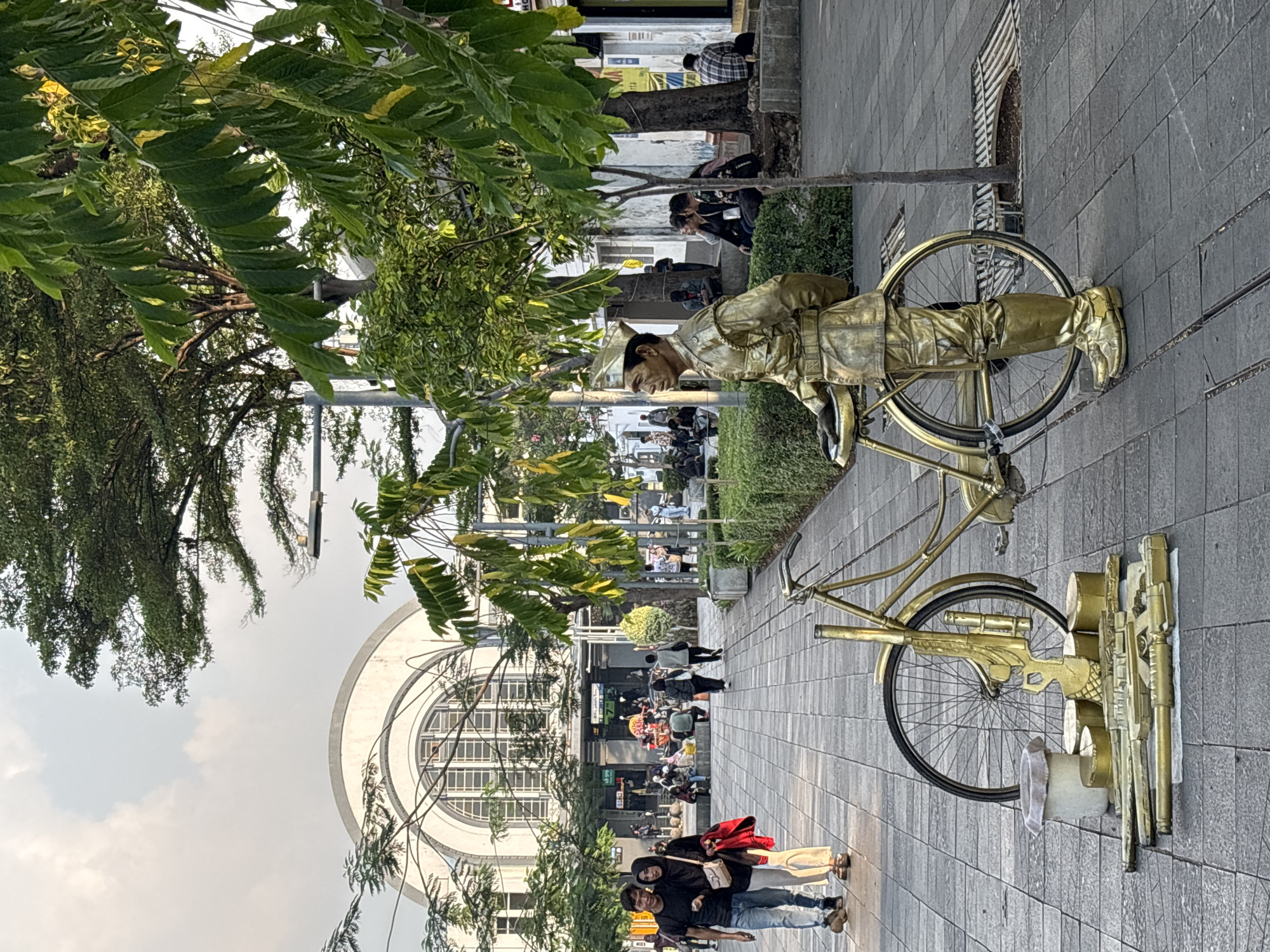 Street performers and tourists in Jakarta's historic Kota Tua district