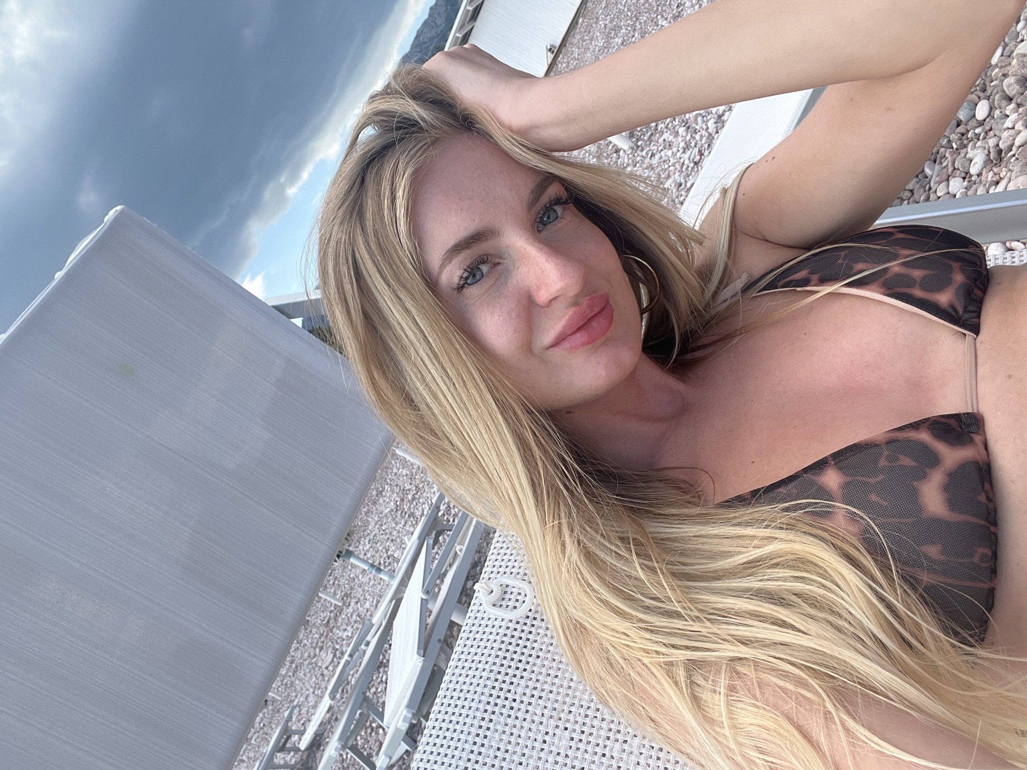 Blonde women take beach selfies at Sveti Stefan resort