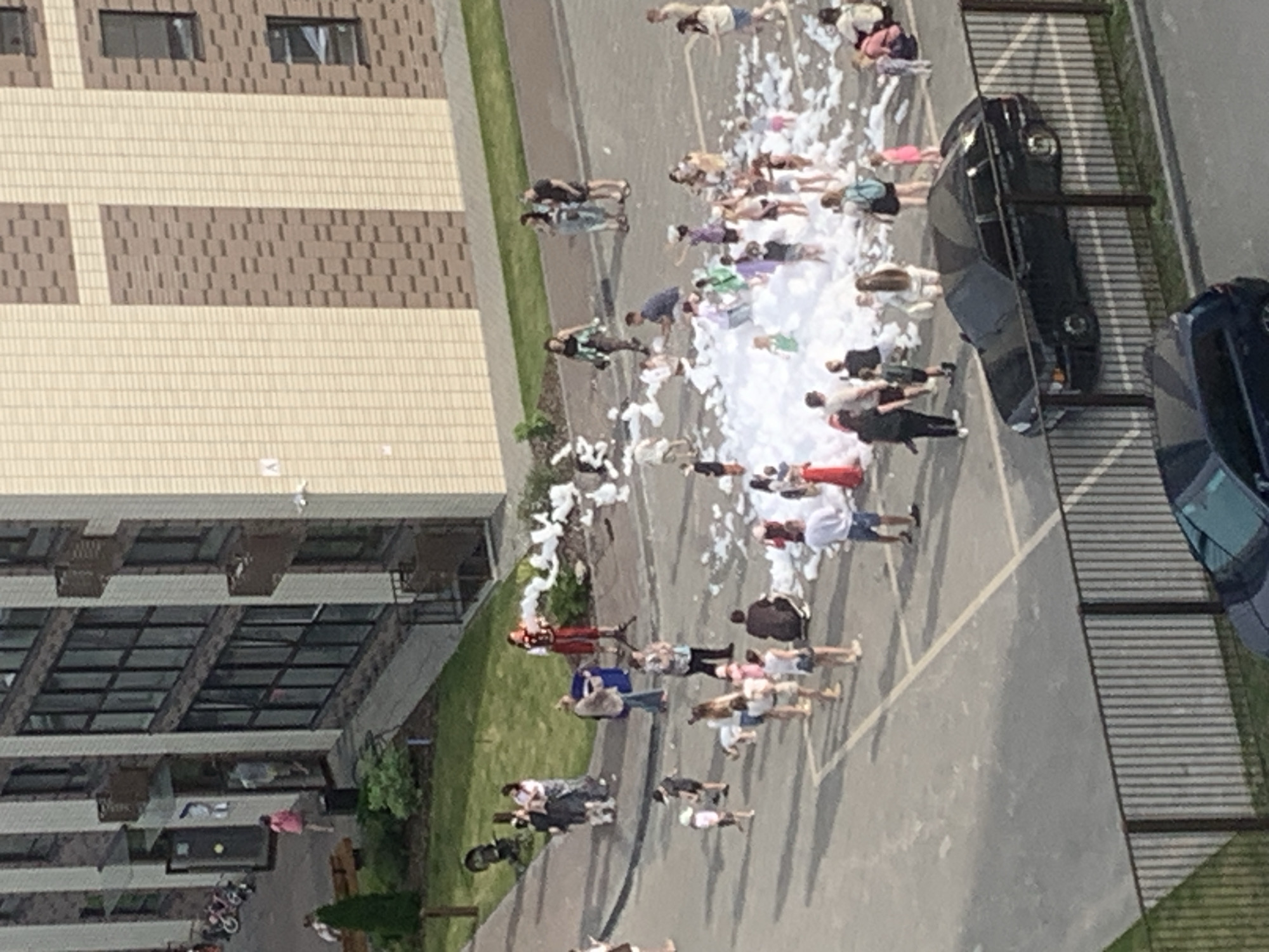 Outdoor foam party fills Kirov apartment courtyard on summer afternoon