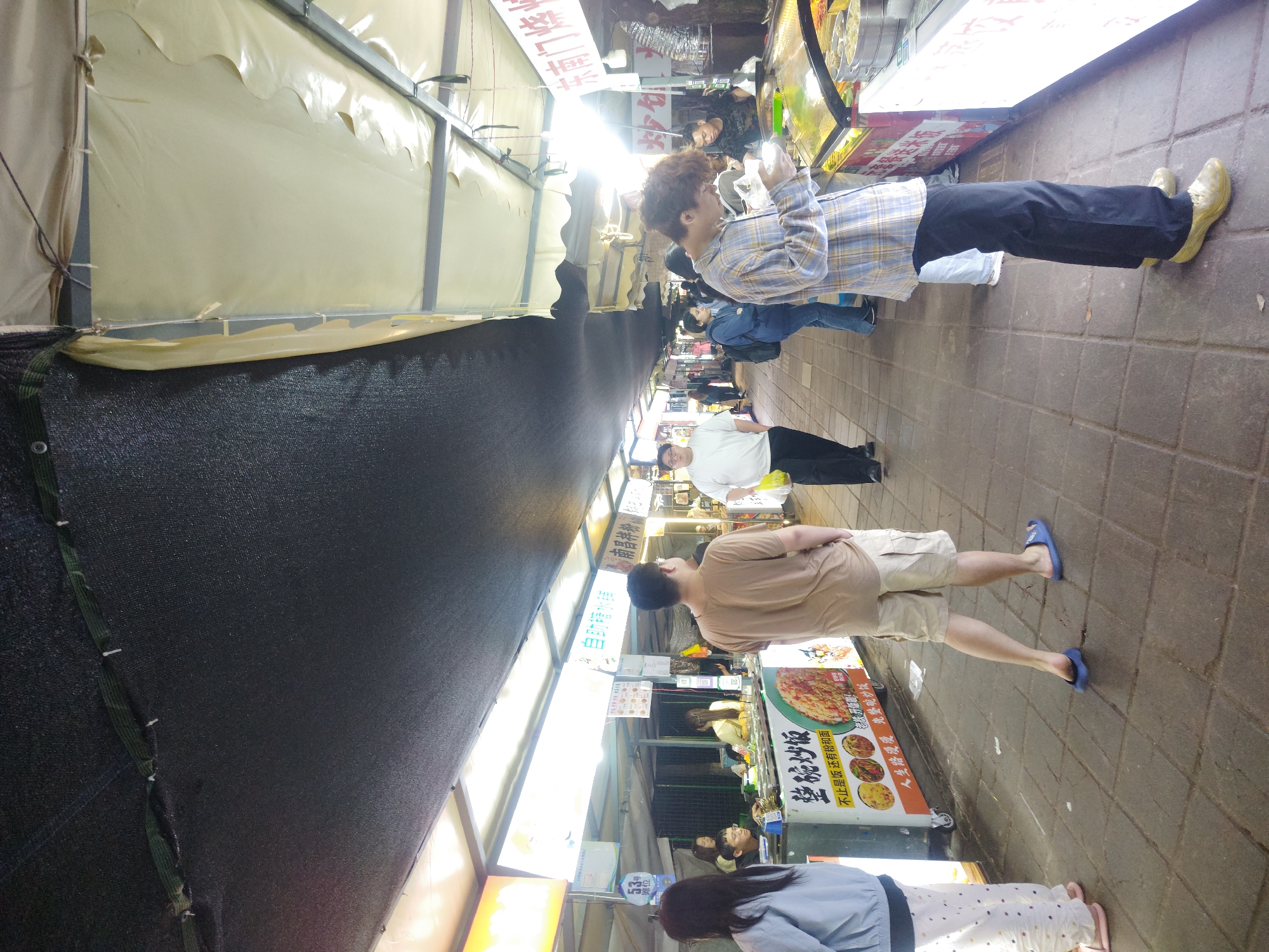 Evening food market bustles in Shapingba District, China
