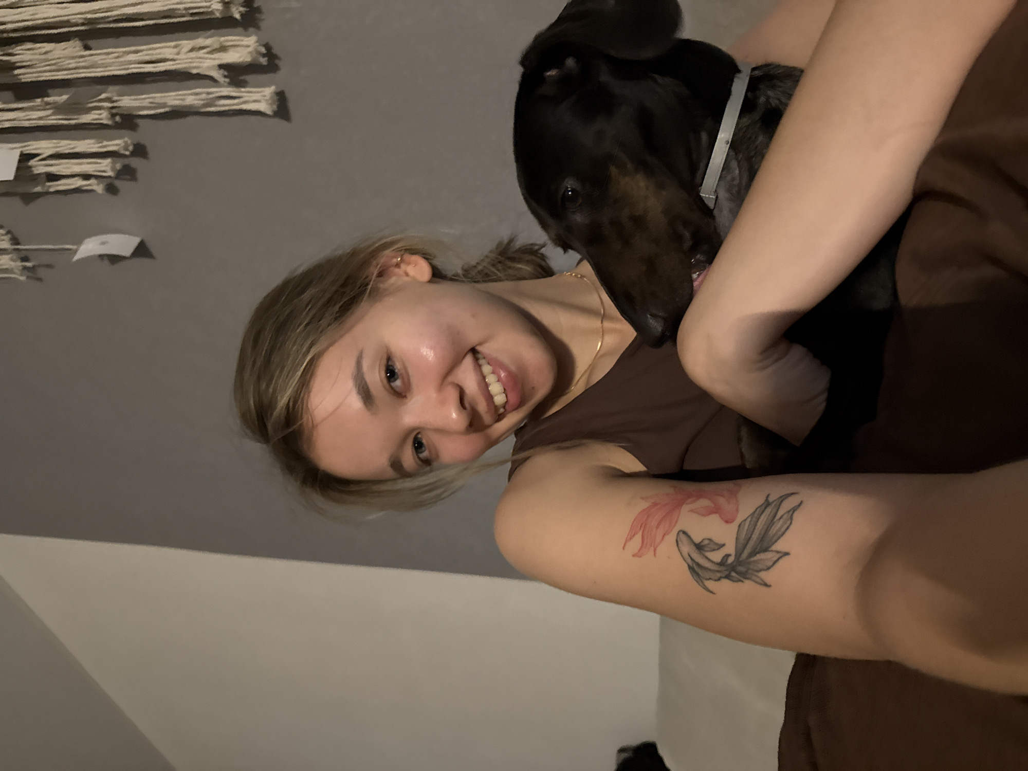 Woman documents afternoon with pets and flowers in Noviy