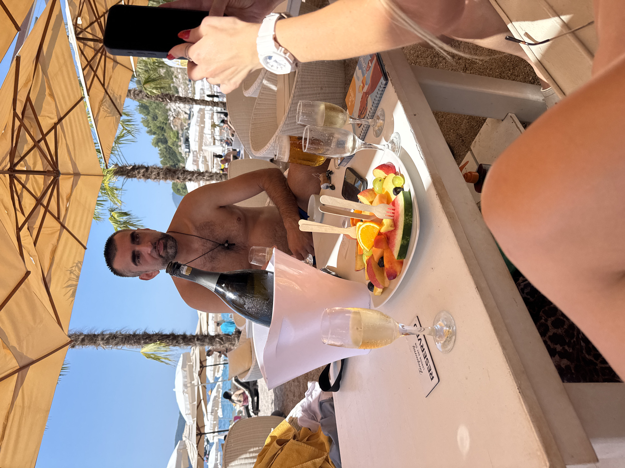 Champagne and selfies at a sunny beach club