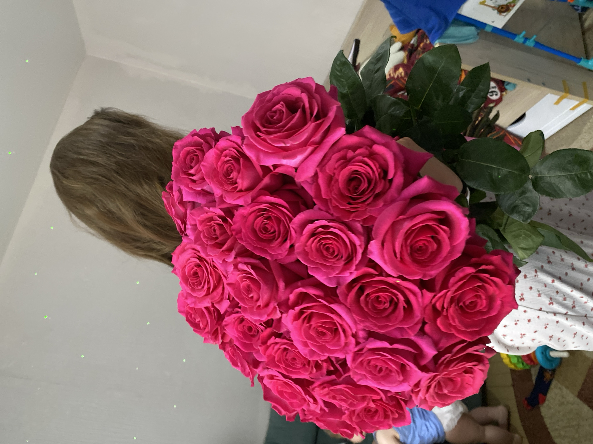 Woman receives pink roses during home cooking in Votkinsk