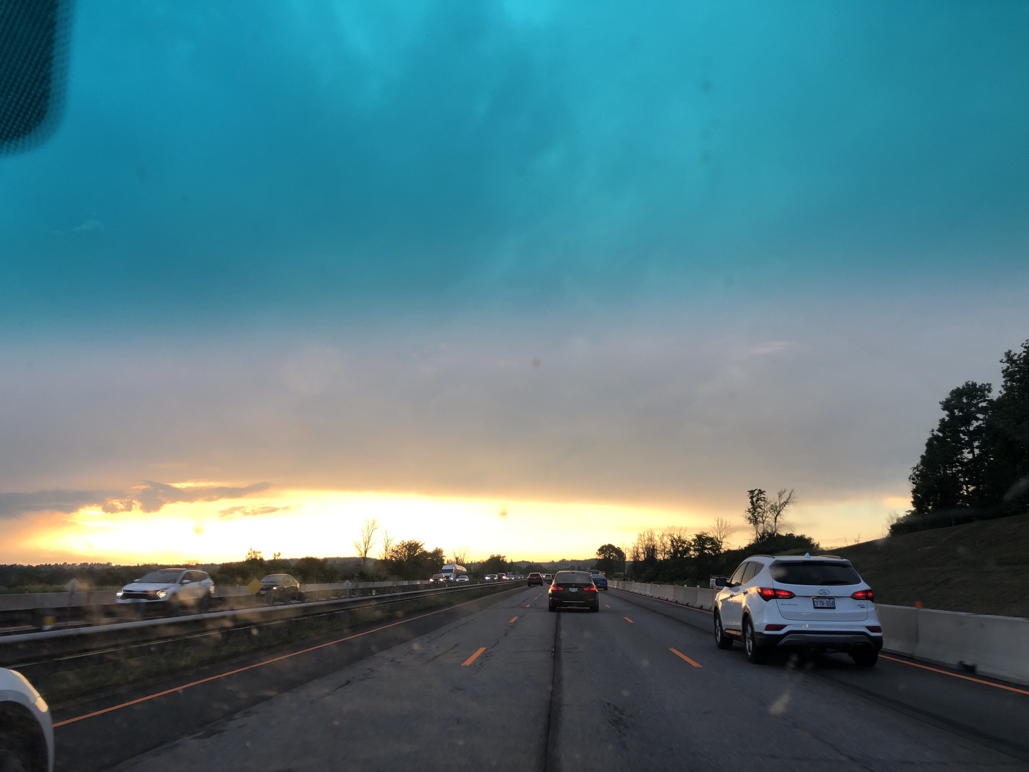 Sunset sky over an Ontario highway drive