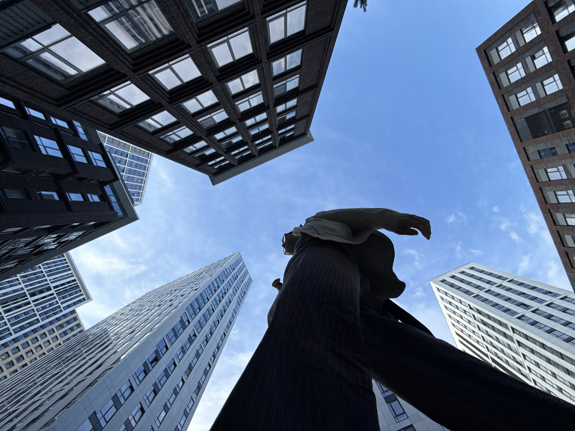Low-angle urban self-portraits among Moscow's modern skyscrapers