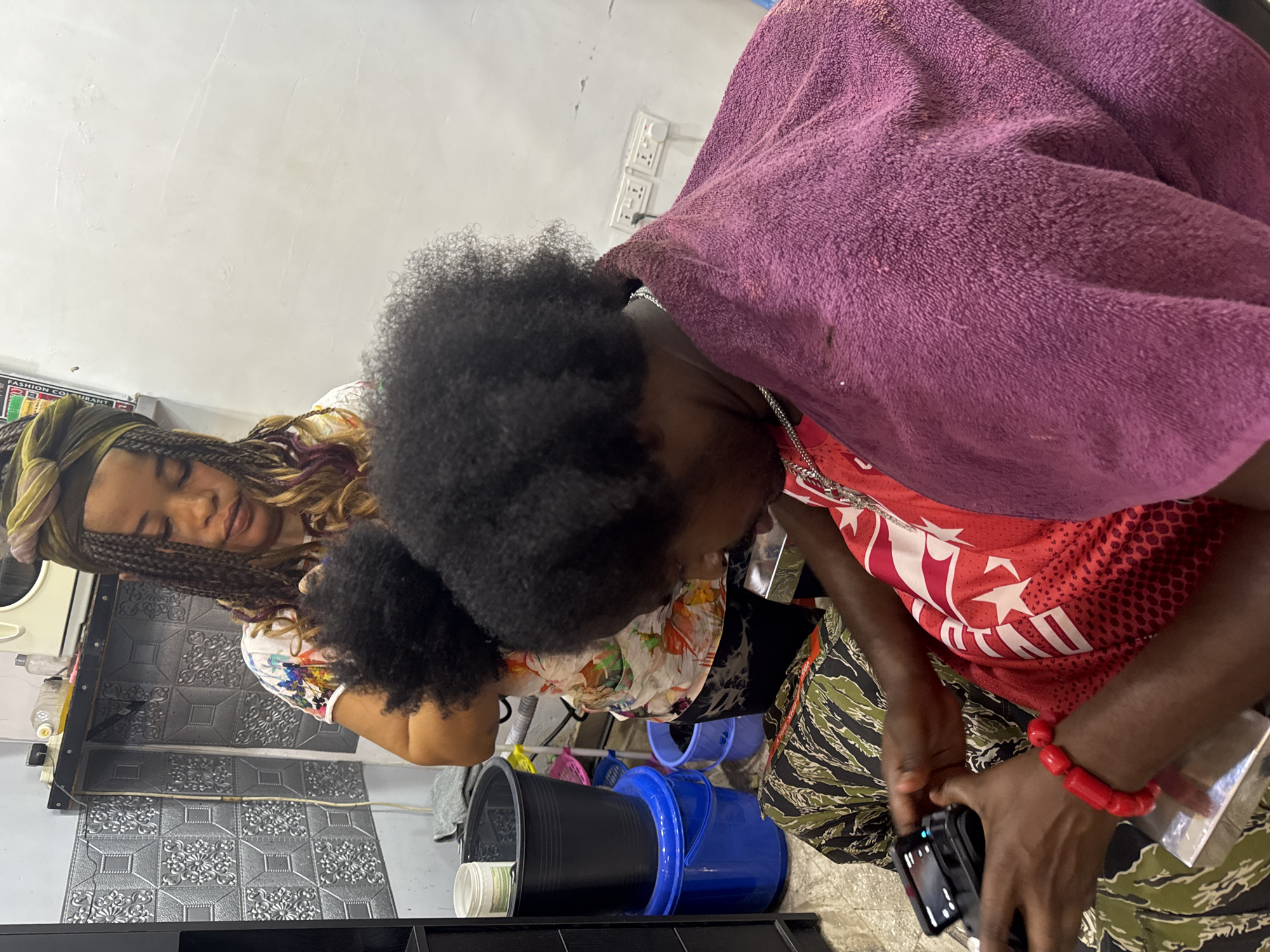 Evening hair salon activity documented at Citytrims Enterprise, Dome Ghana
