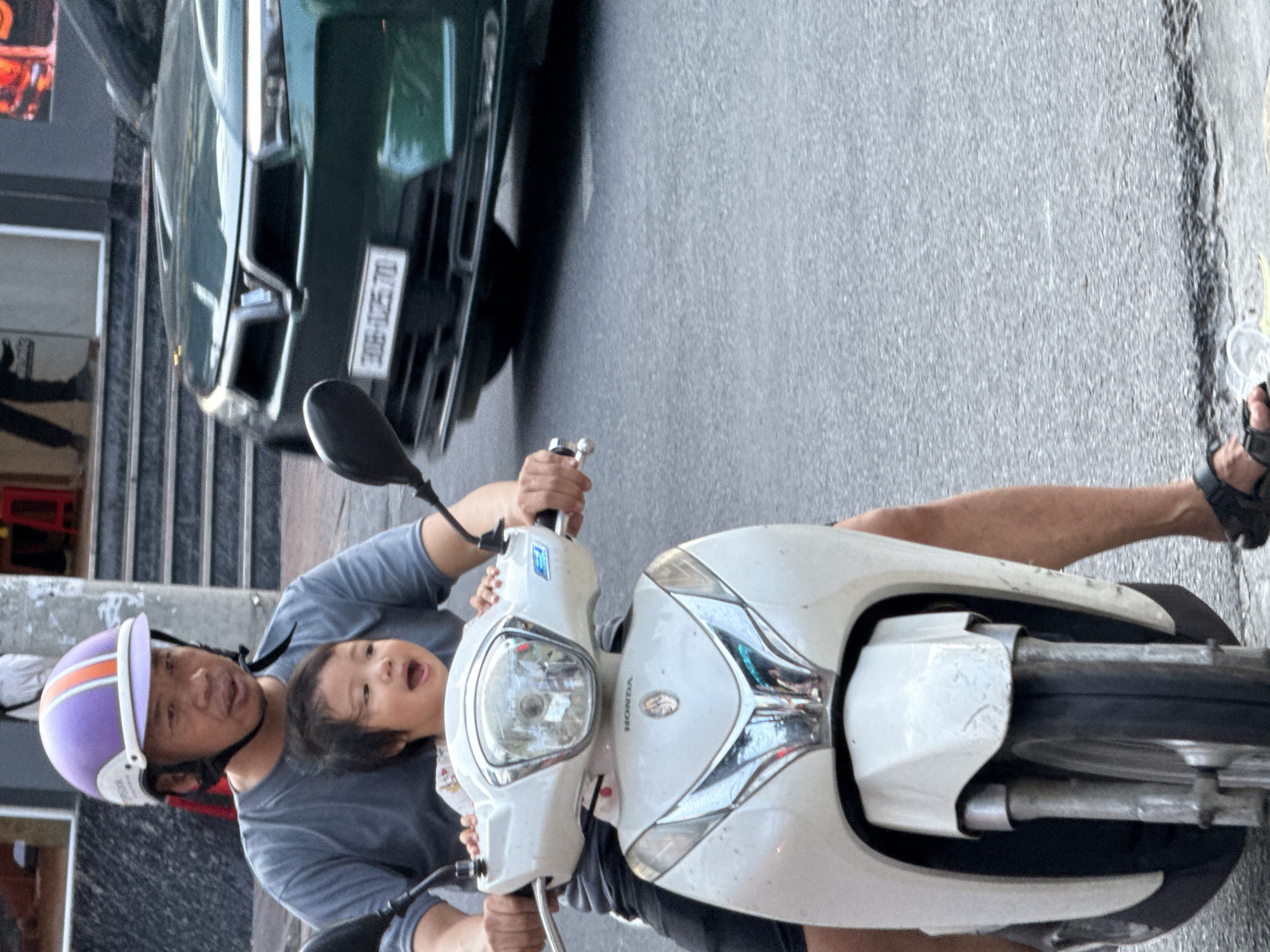 Nha Trang street life: scooters, pedestrians, and city rhythm
