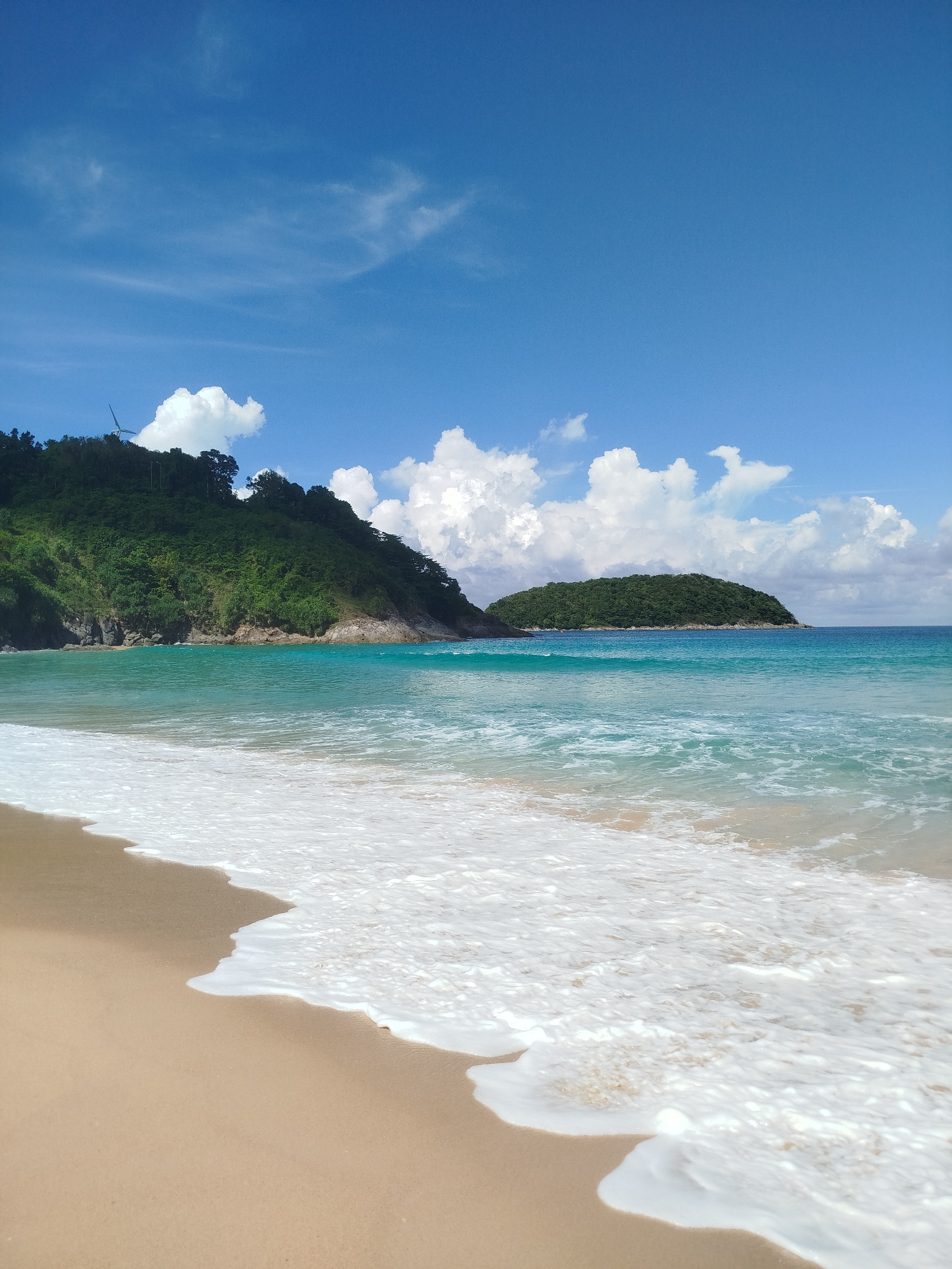 Beach day at Rawai Thailand with palm trees and turquoise water