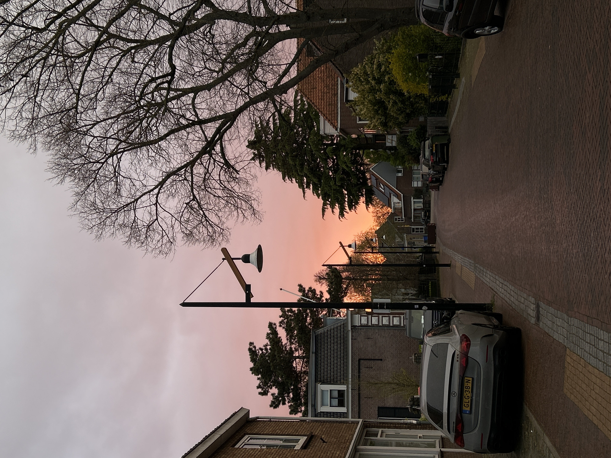 Mercedes parked on Sliedrecht street during colorful dusk
