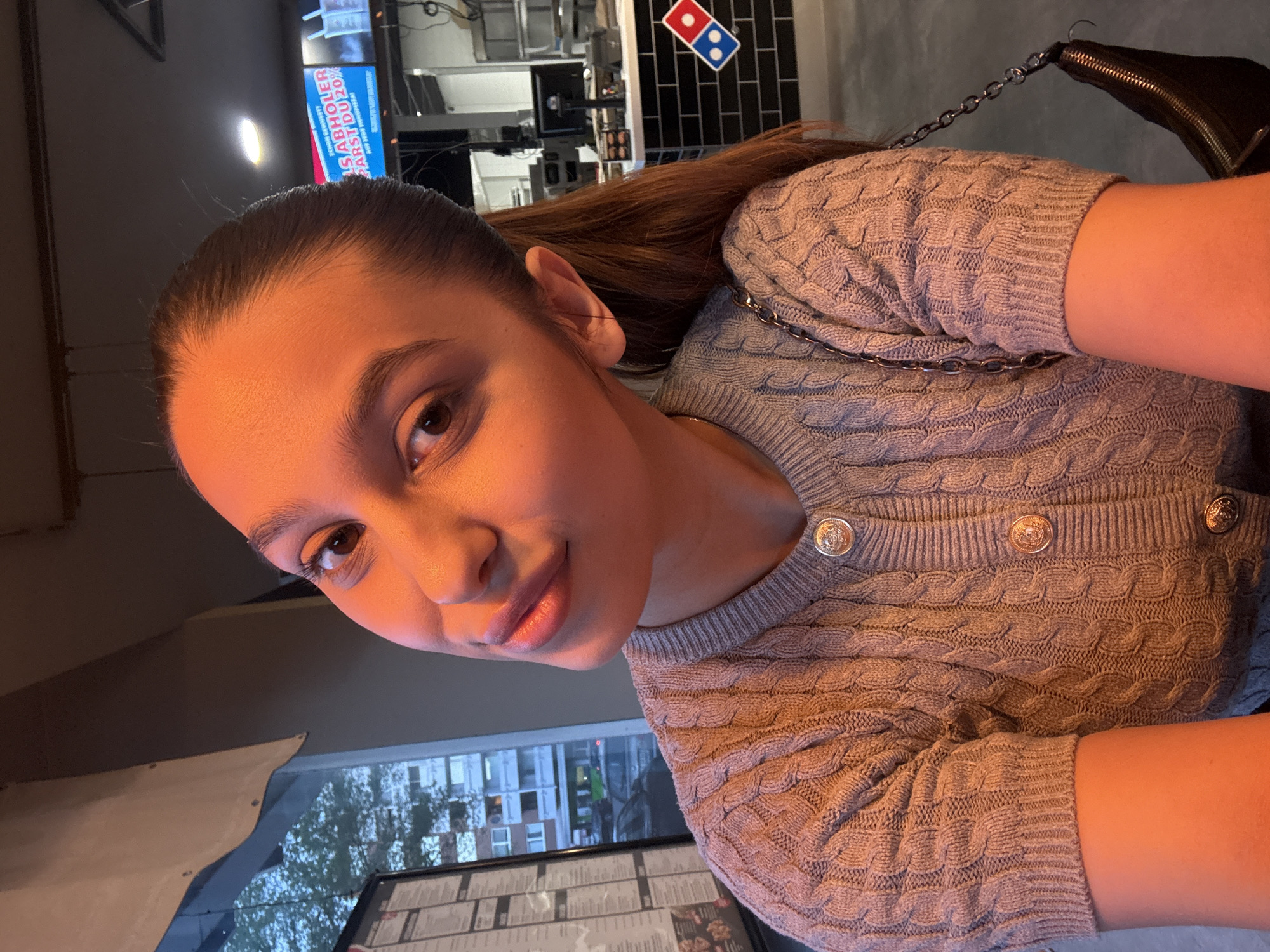 Woman takes selfies at Domino's Pizza in Mönchengladbach