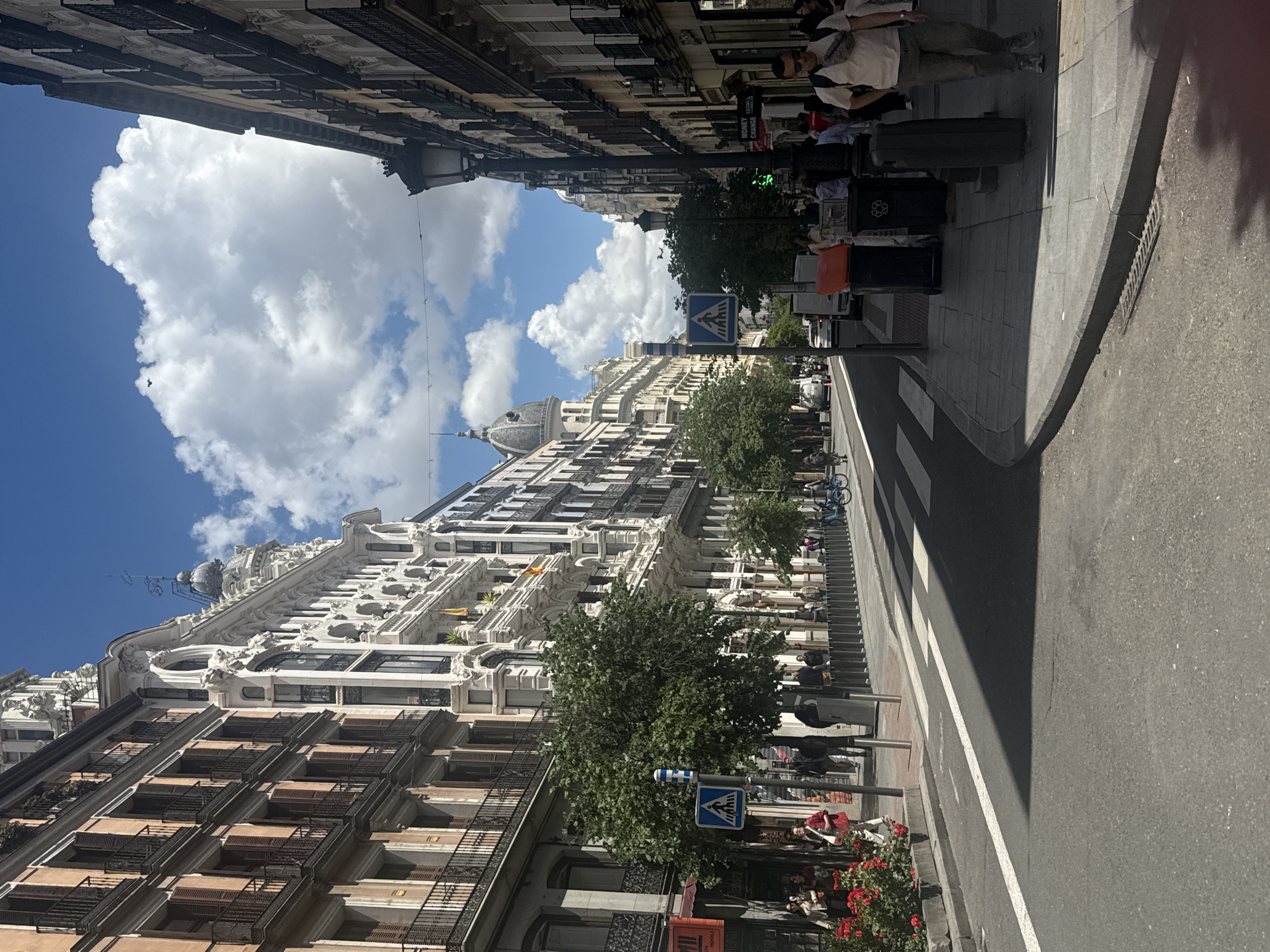 Madrid residents enjoy sunny weather in city center