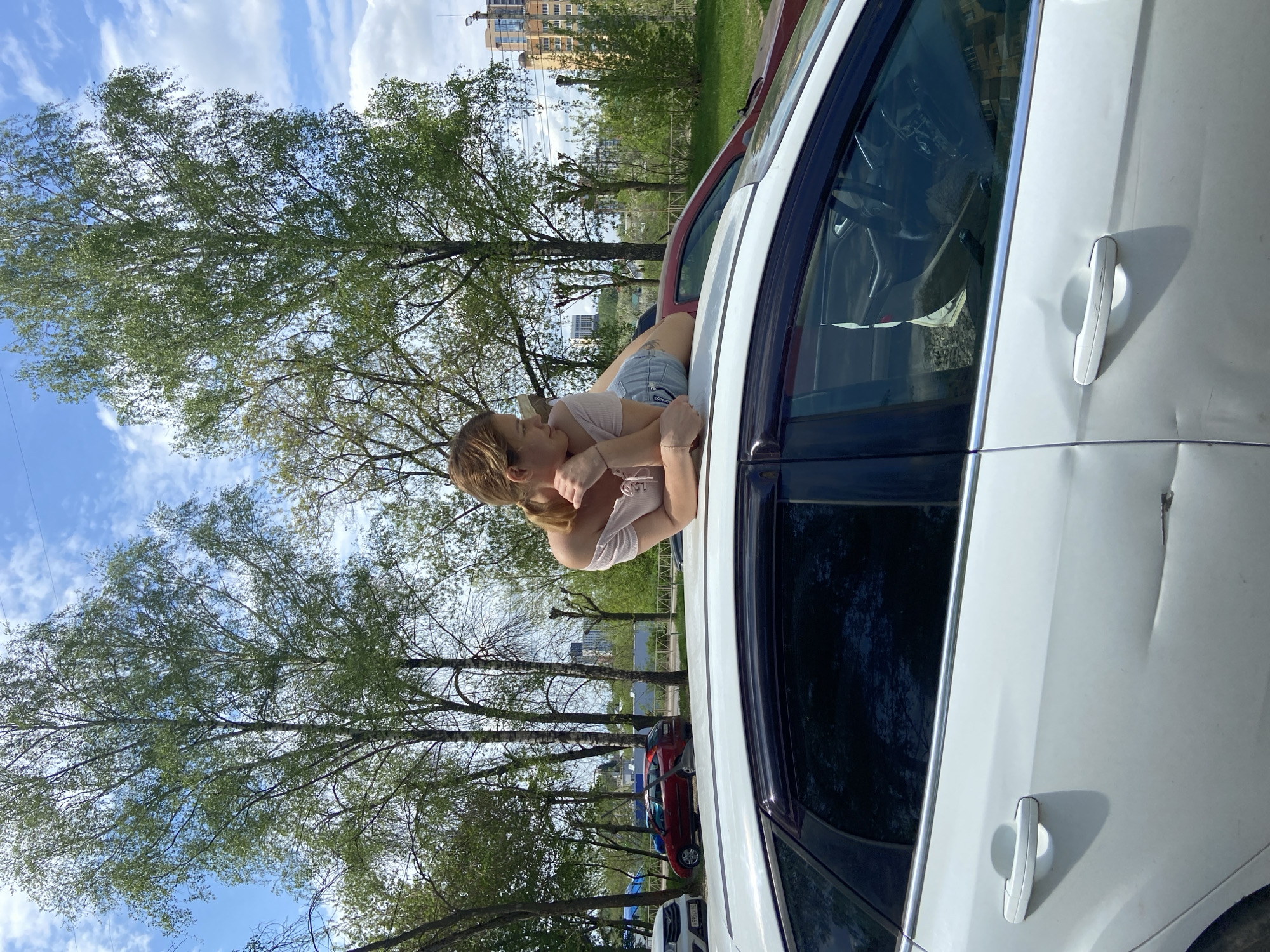Woman enjoys sunny morning walk with dog in Ryazan