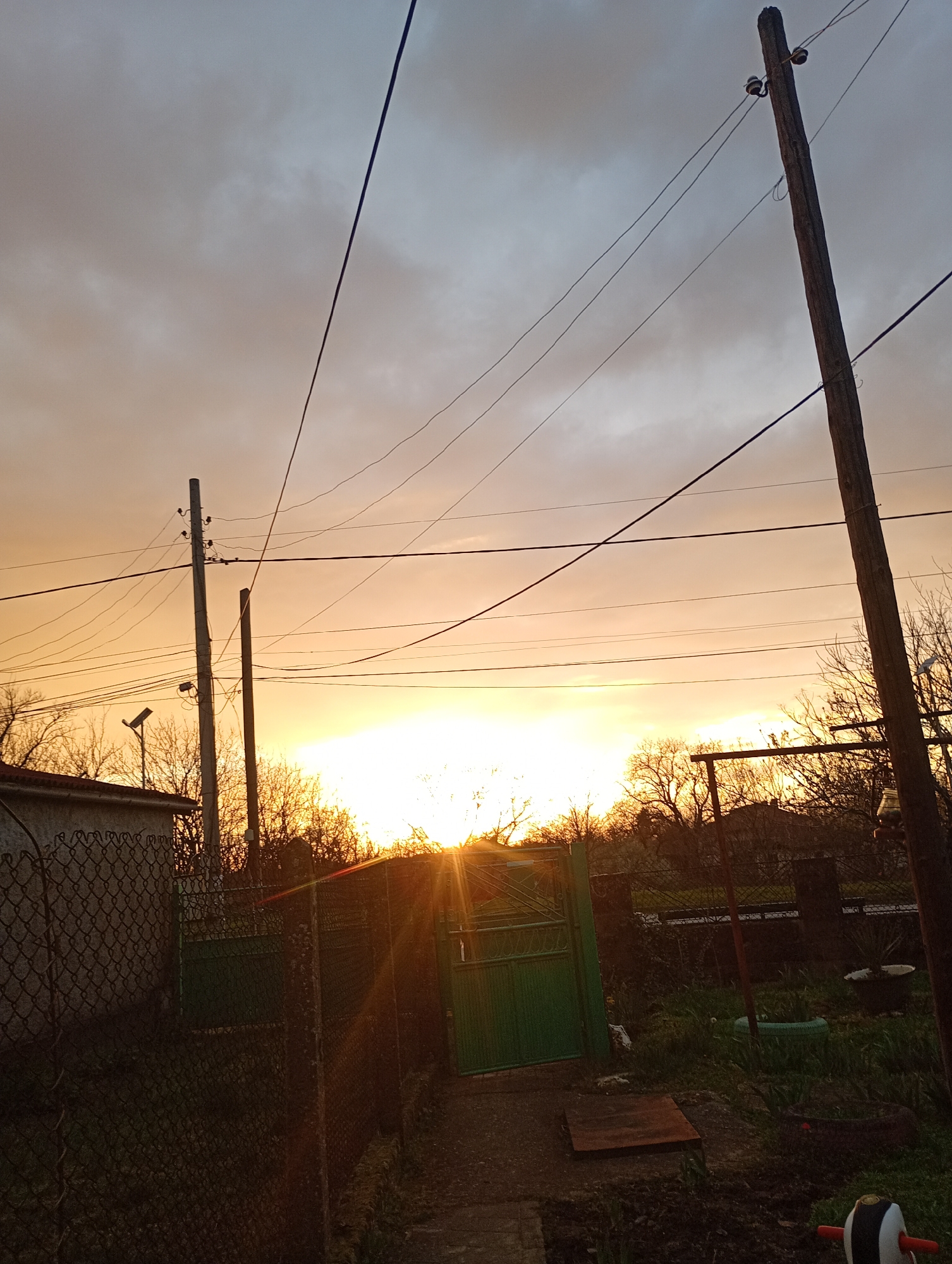 Sunset observed over Alfatar, Bulgaria with silhouetted infrastructure
