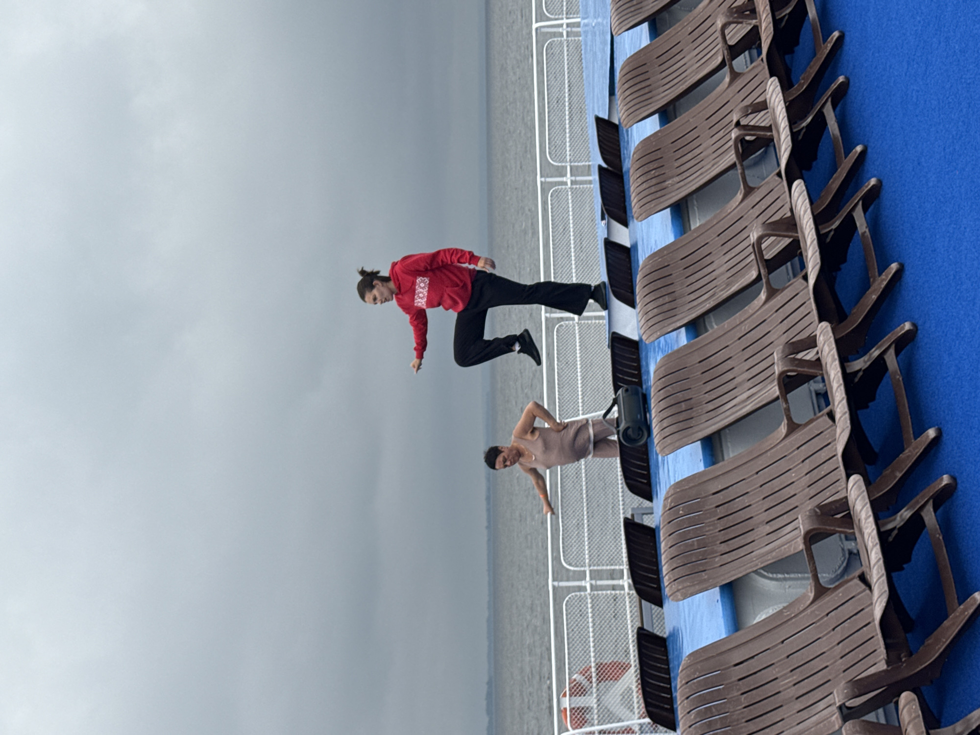 Ferry deck life on a cloudy Russian waterway