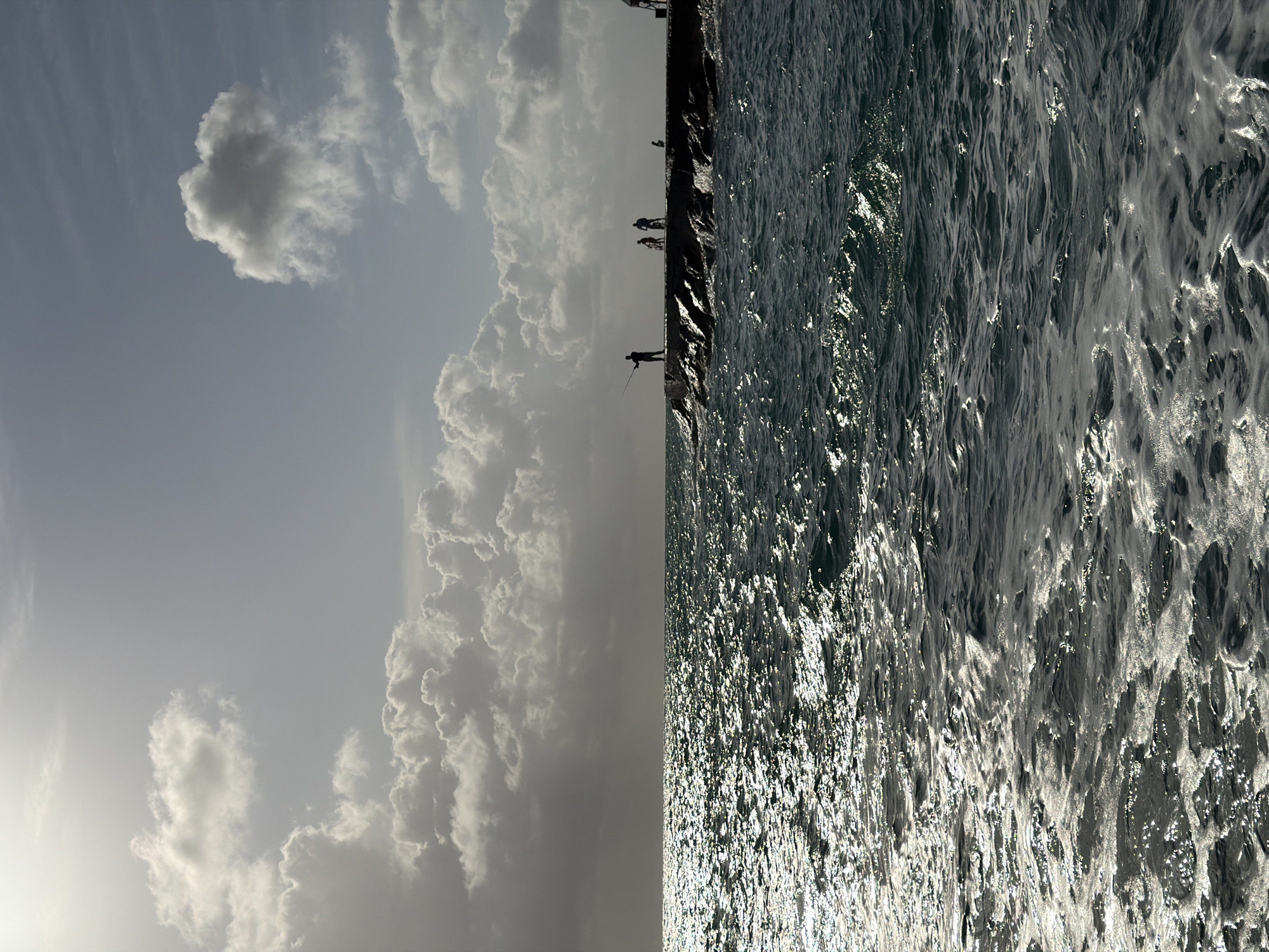 Cloudy skies and ocean views captured at Bal Harbour breakwater