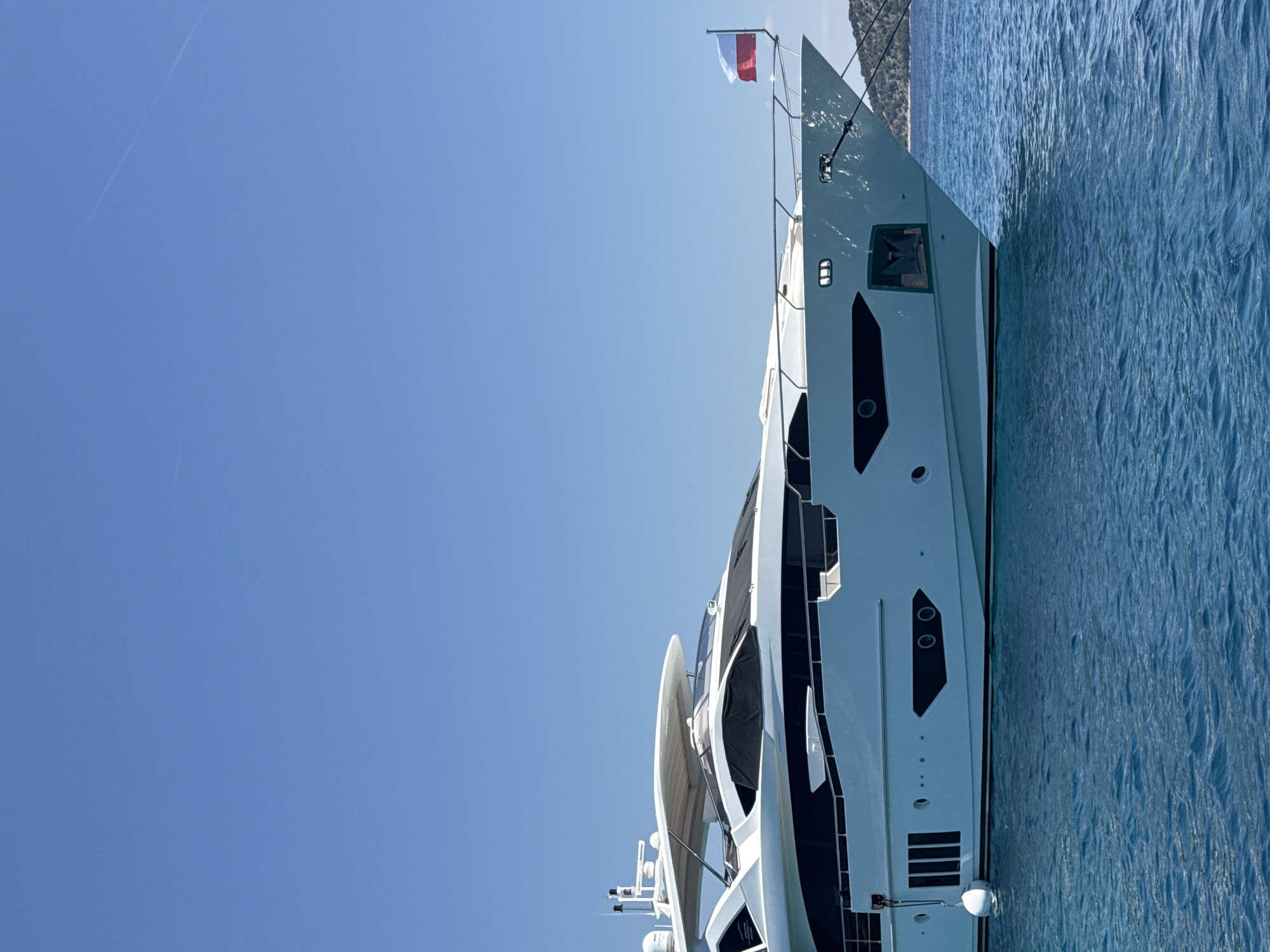 Luxury yacht anchored off Šibenik with waterside dining nearby