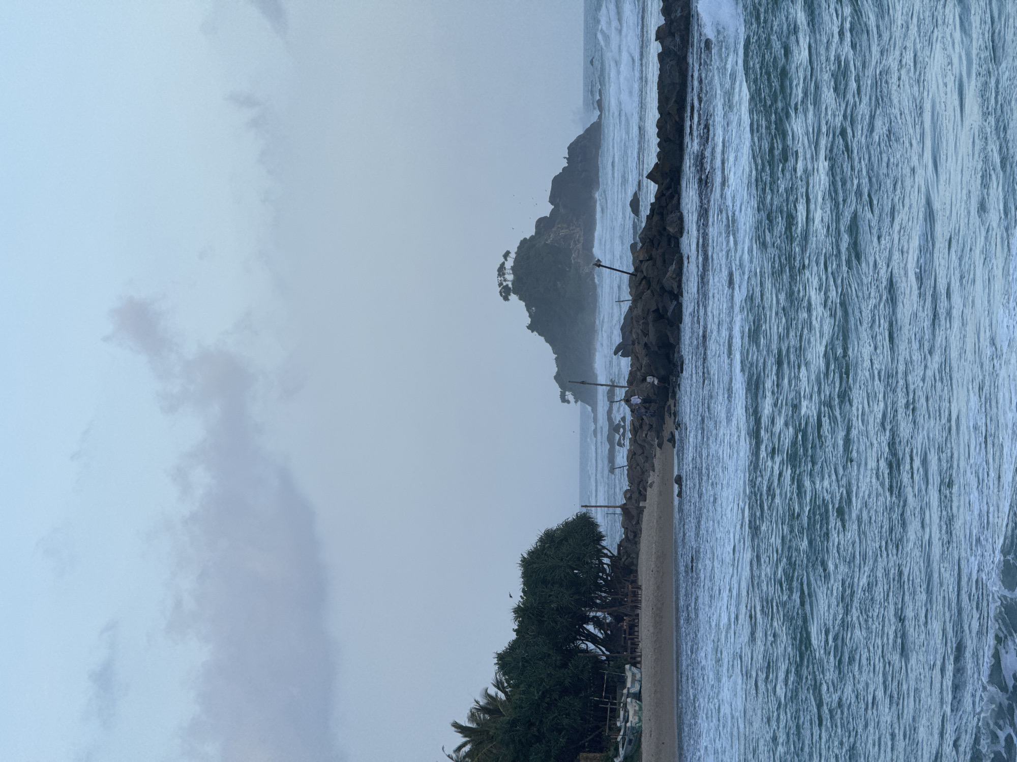 Coastal day at Goviyapana: swimming, rocks, and a beachside grill