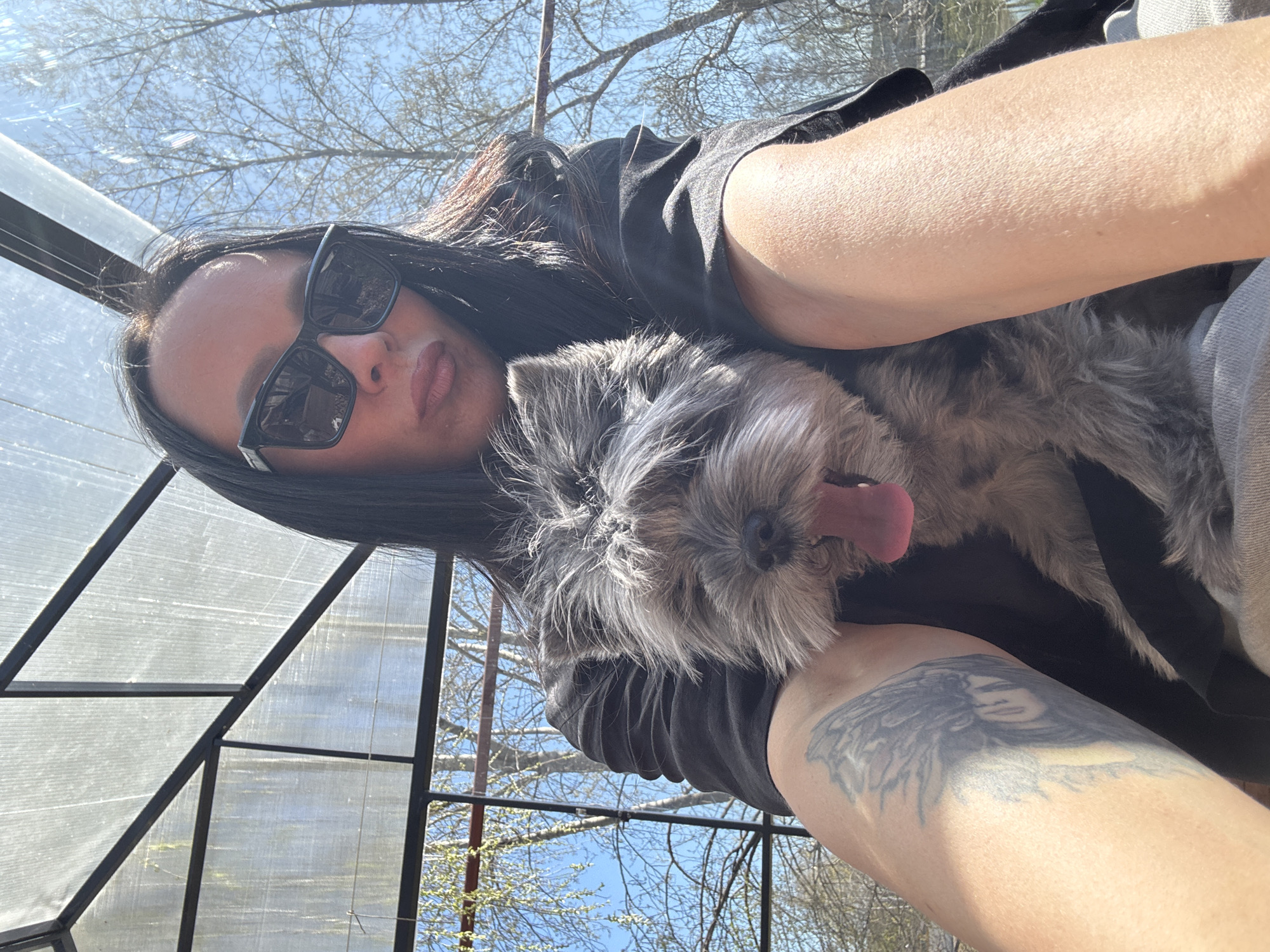 Woman enjoys morning park visit with dog in Chaikovsky