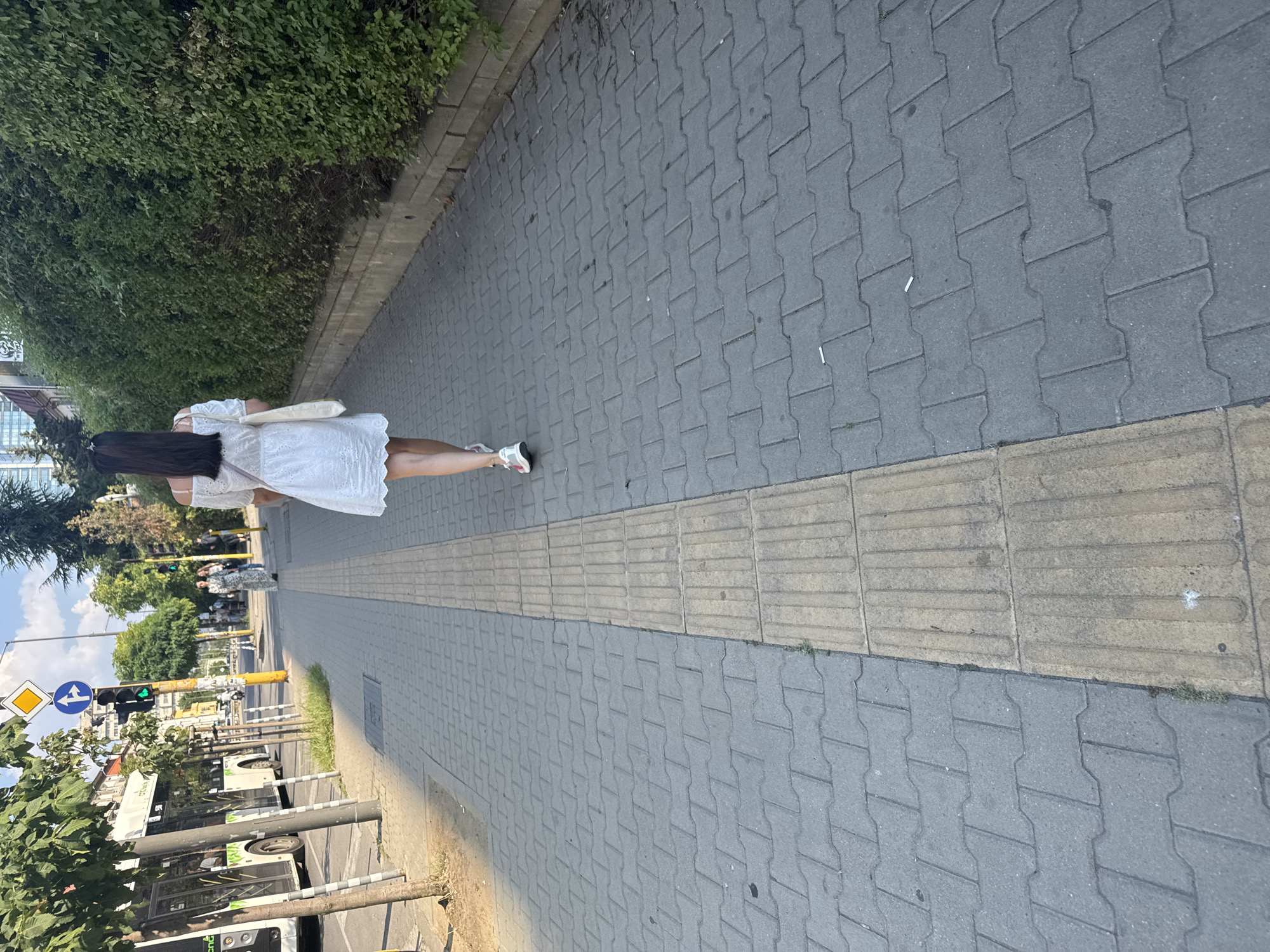 Afternoon street photography around a Sofia skyscraper