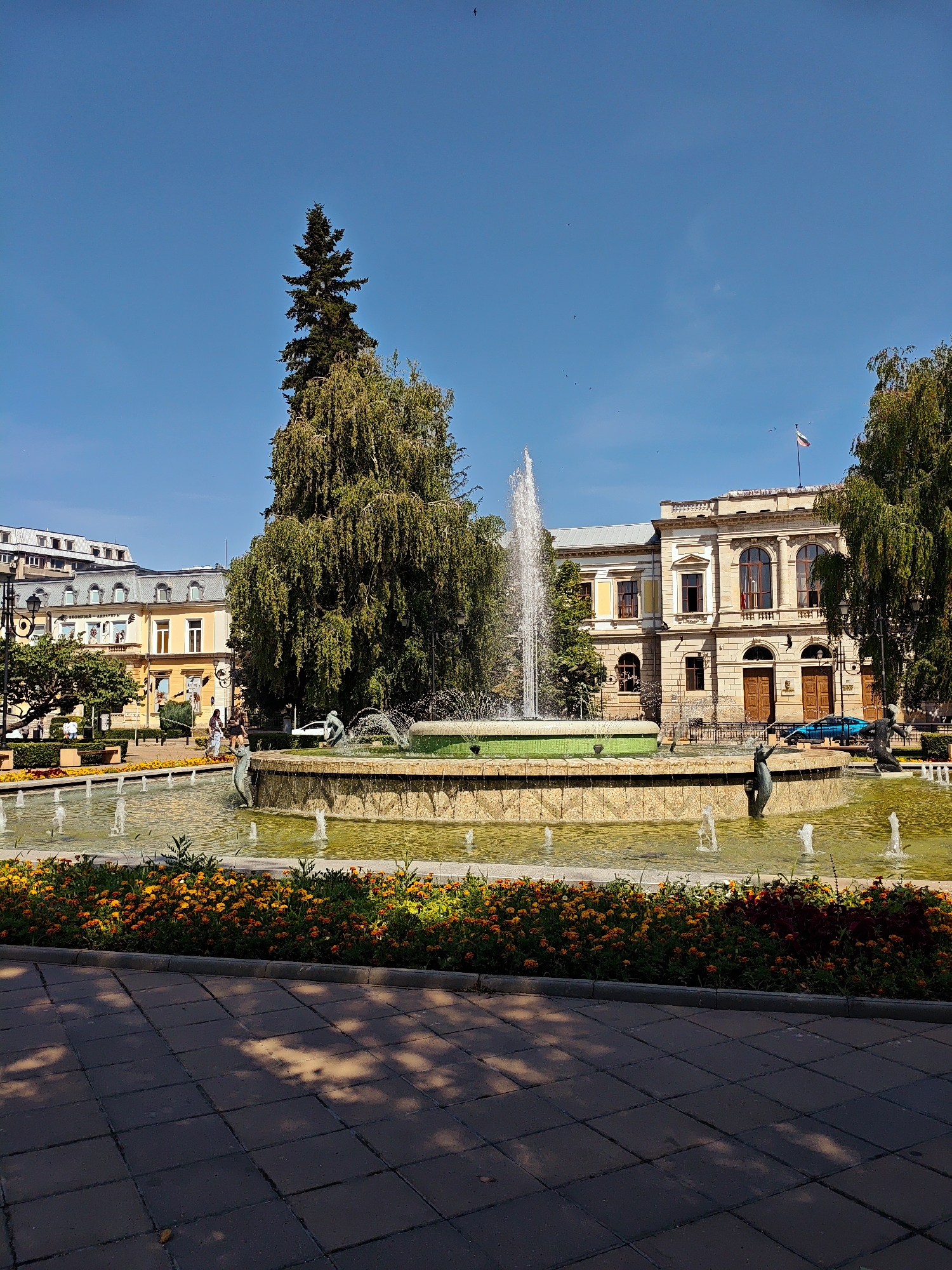 Sunny morning at Ruse's fountain square and museum park