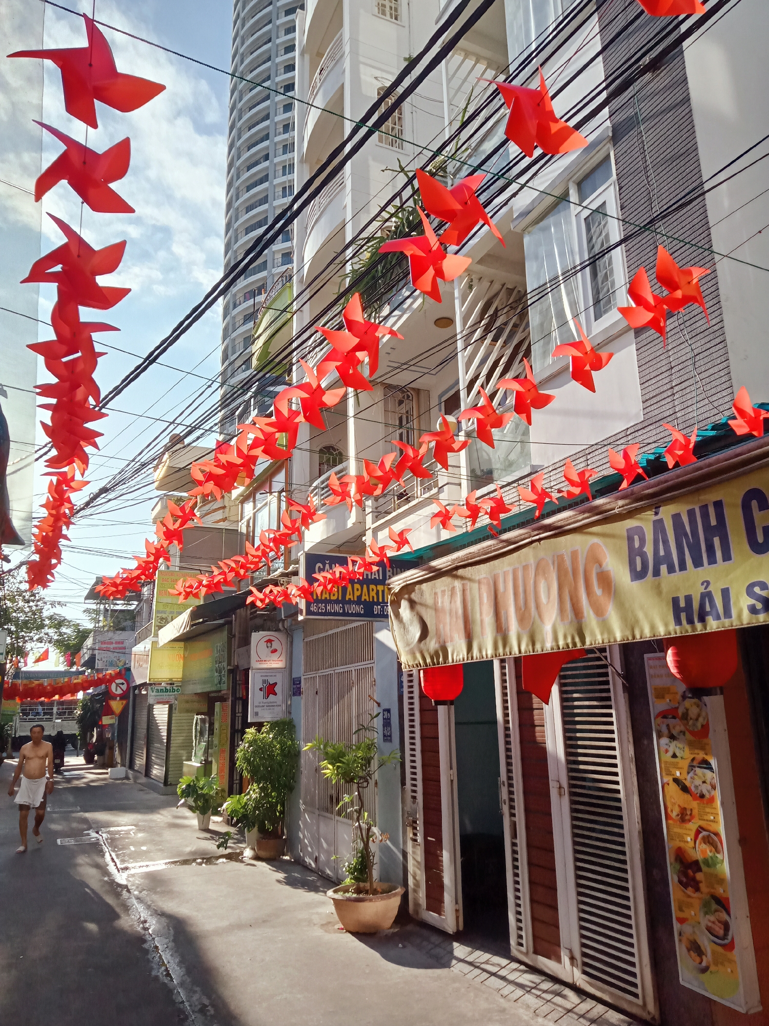 Red paper decorations illuminate narrow Nha Trang street
