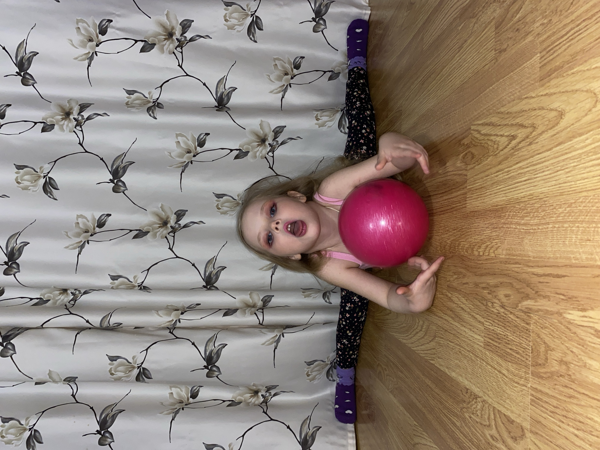 Young Girl Practices Gymnastics at Home in Votkinsk