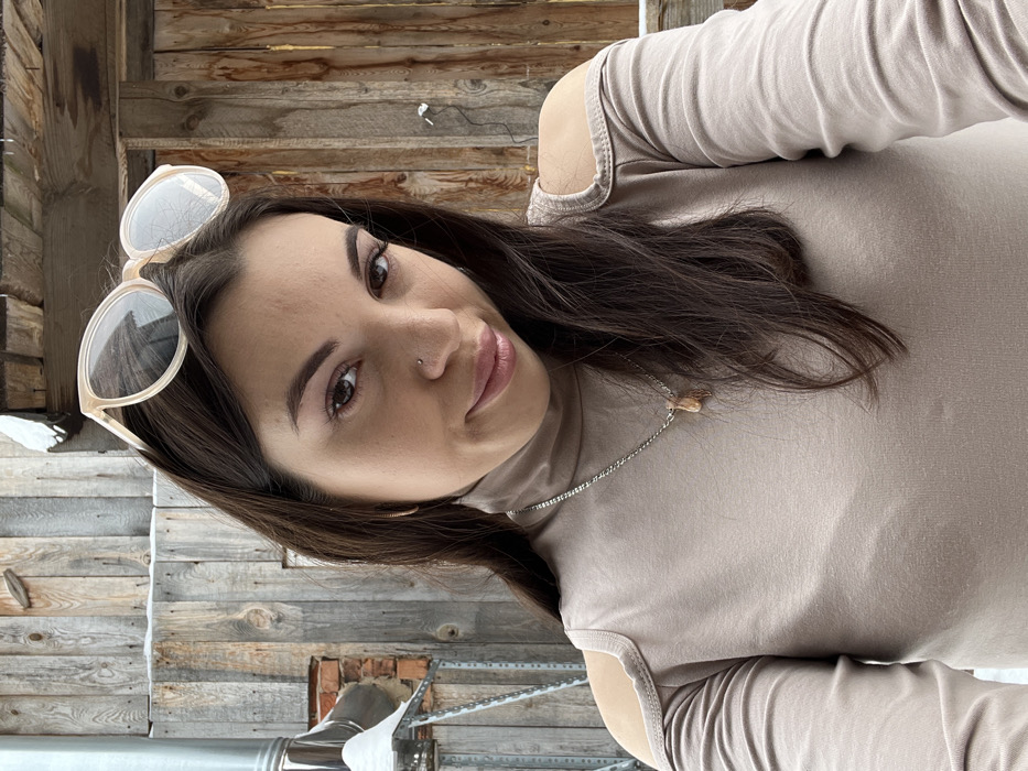 Woman photographed in casual moments with pets in Chaikovsky