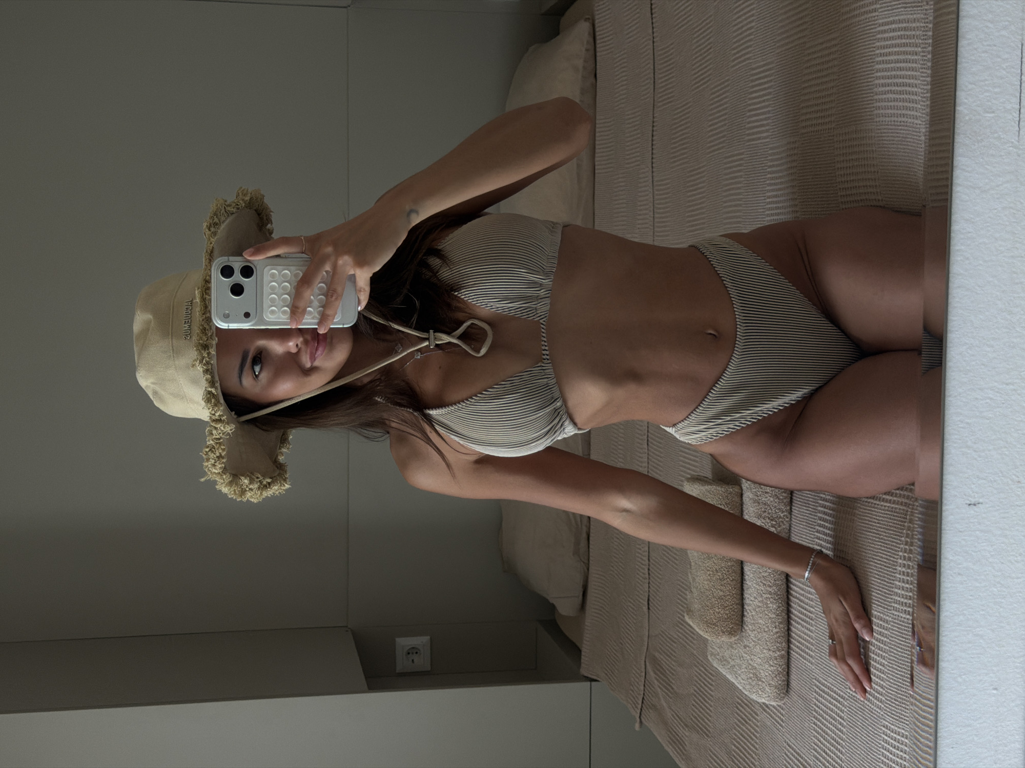 Mirror selfie in a Bodrum hotel room, beach-ready.