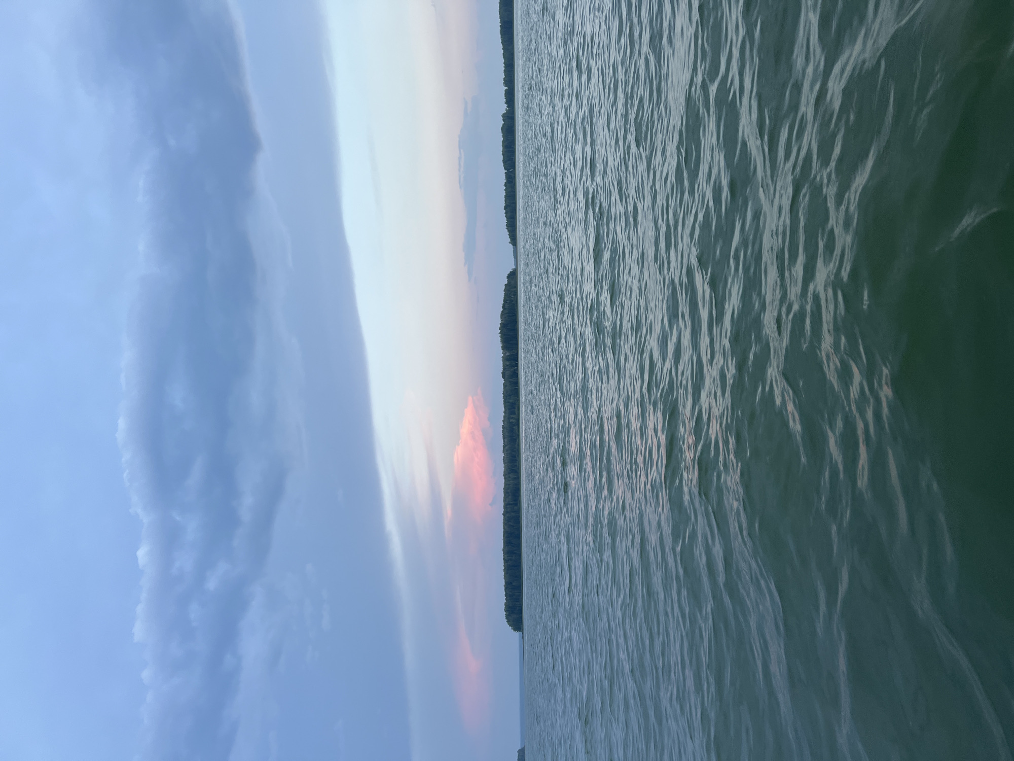 Still water and pastel skies near Novopichugovo at golden hour