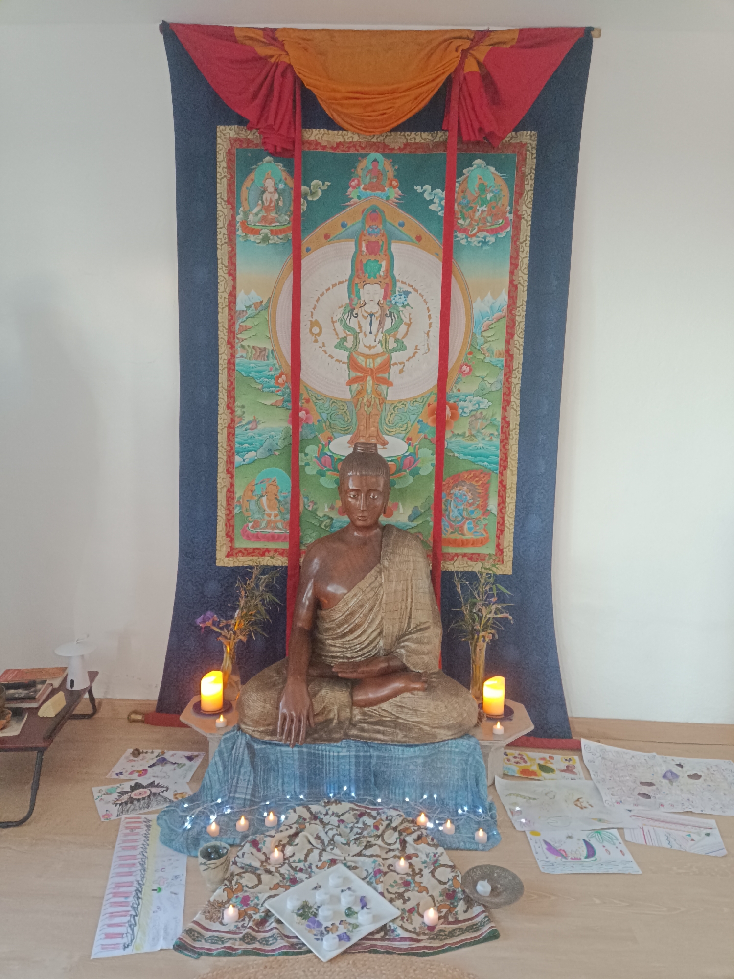 Buddhist altar with wooden statue observed in Jérica, Spain
