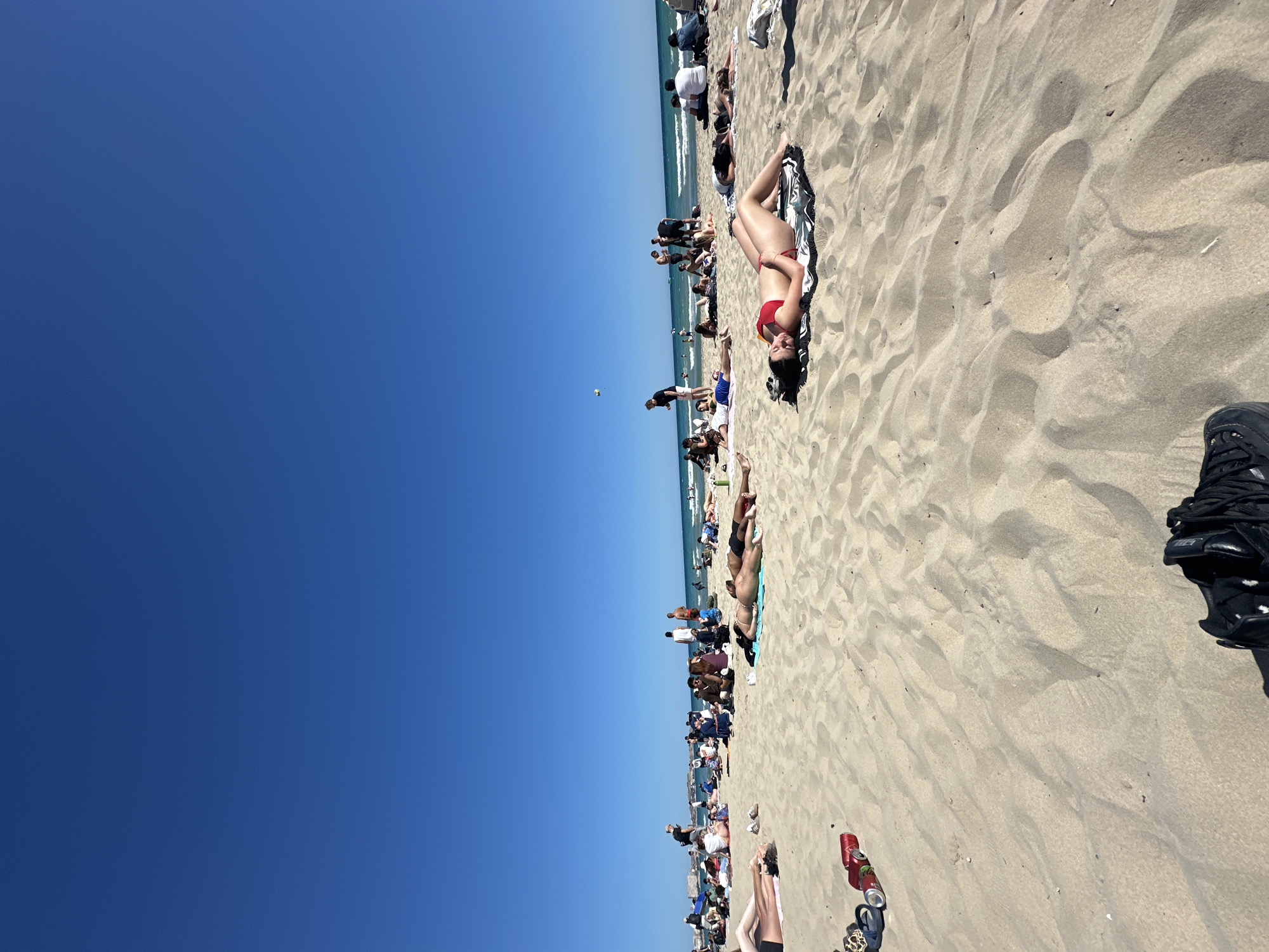 Busy spring afternoon captured along Alicante's crowded beaches and promenade