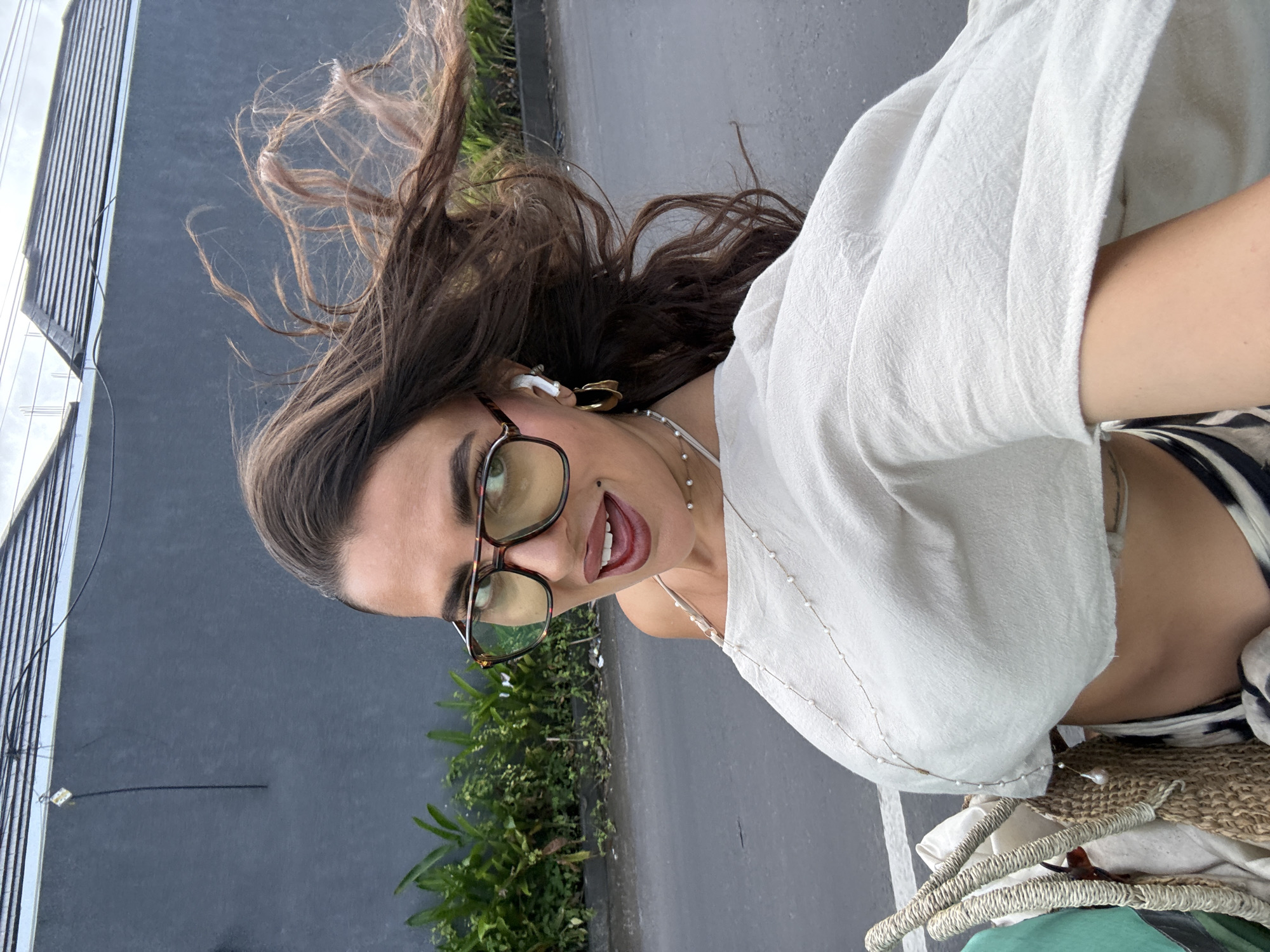Woman takes selfies in early morning Kuta Selatan